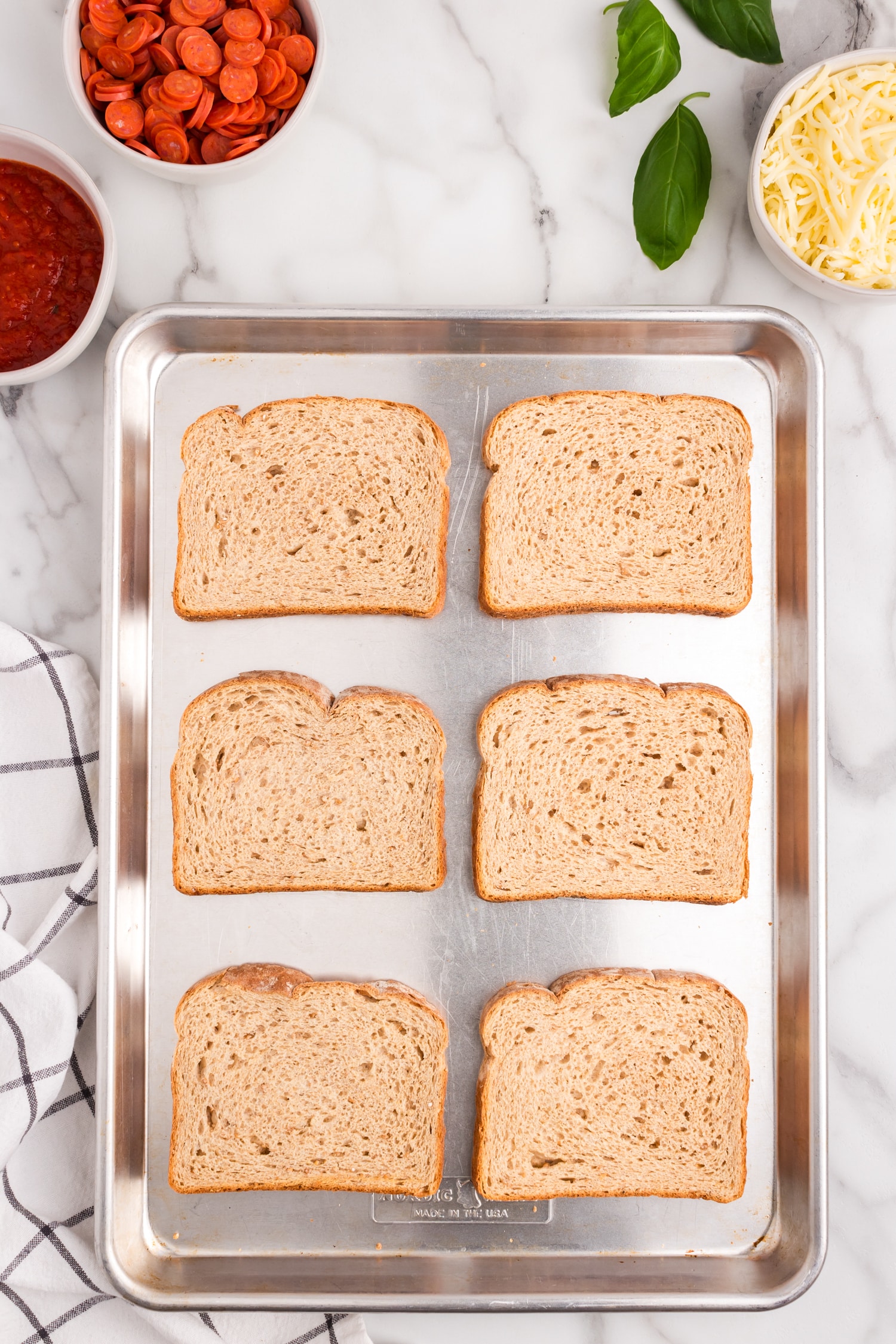 Put the slices of bread onto a baking sheet and bake at 400 for 5 minutes.