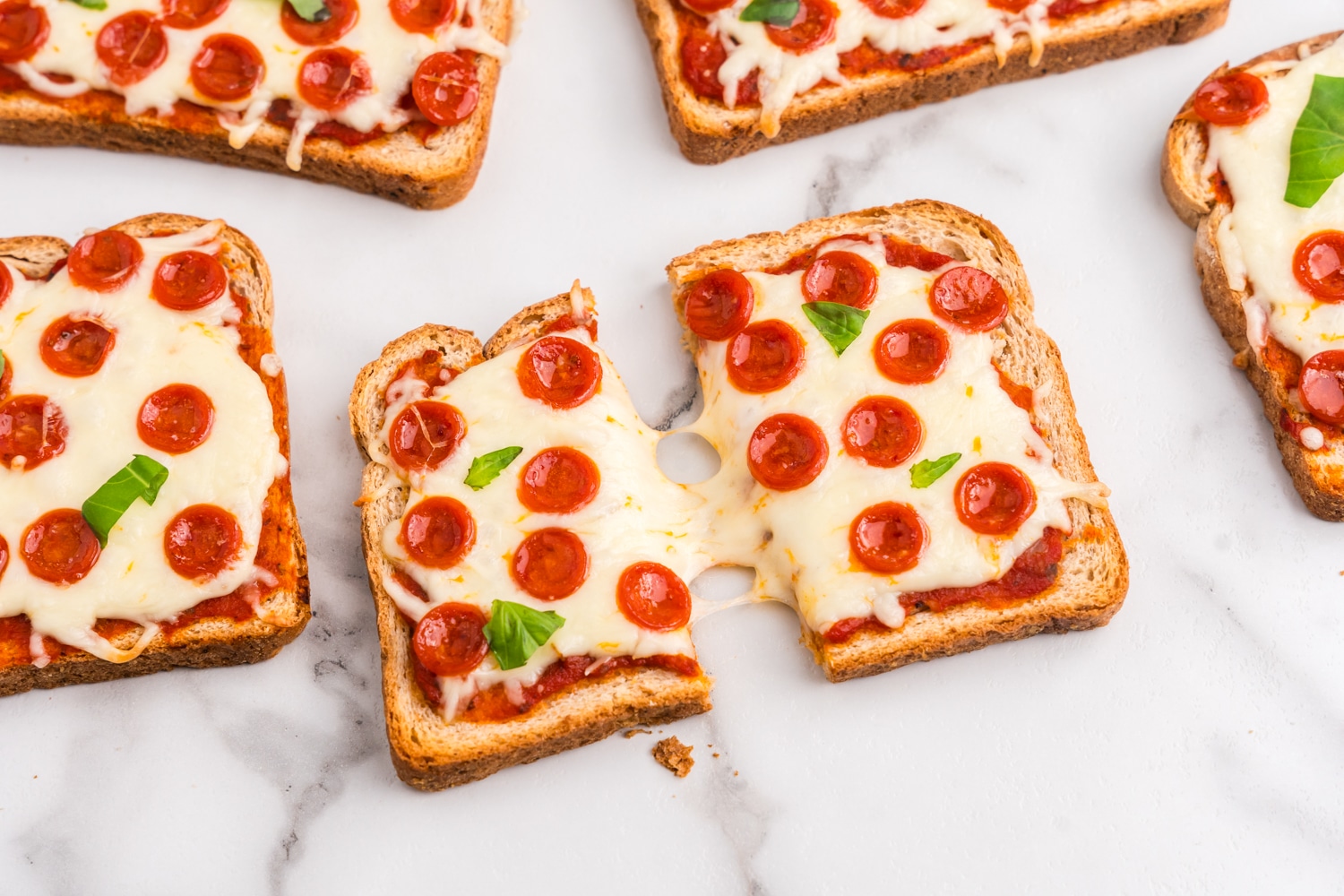 Close up photo of a slice of toast cut in half.