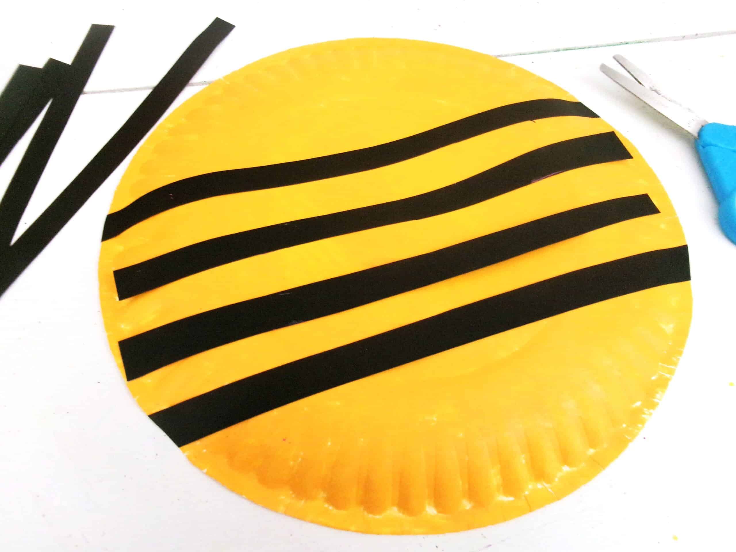 When the paint is completely dried, glue on the black strips of cardstock.