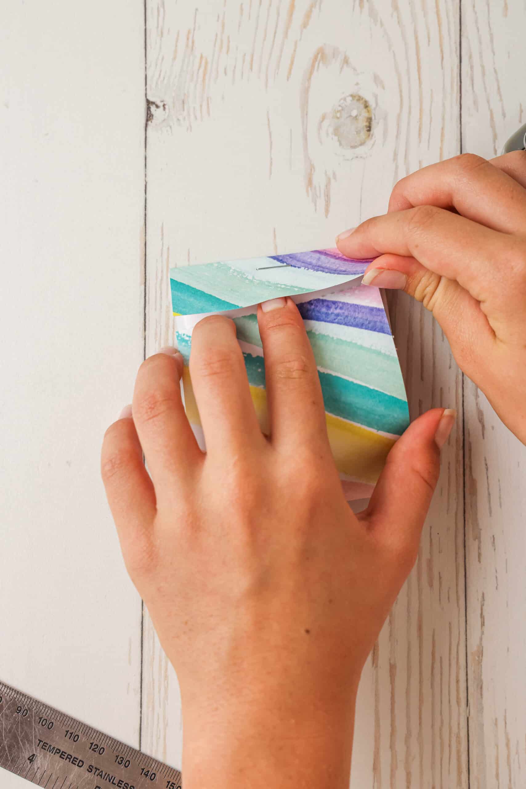 Stick the bottom half under the top lip to shut the notebook.