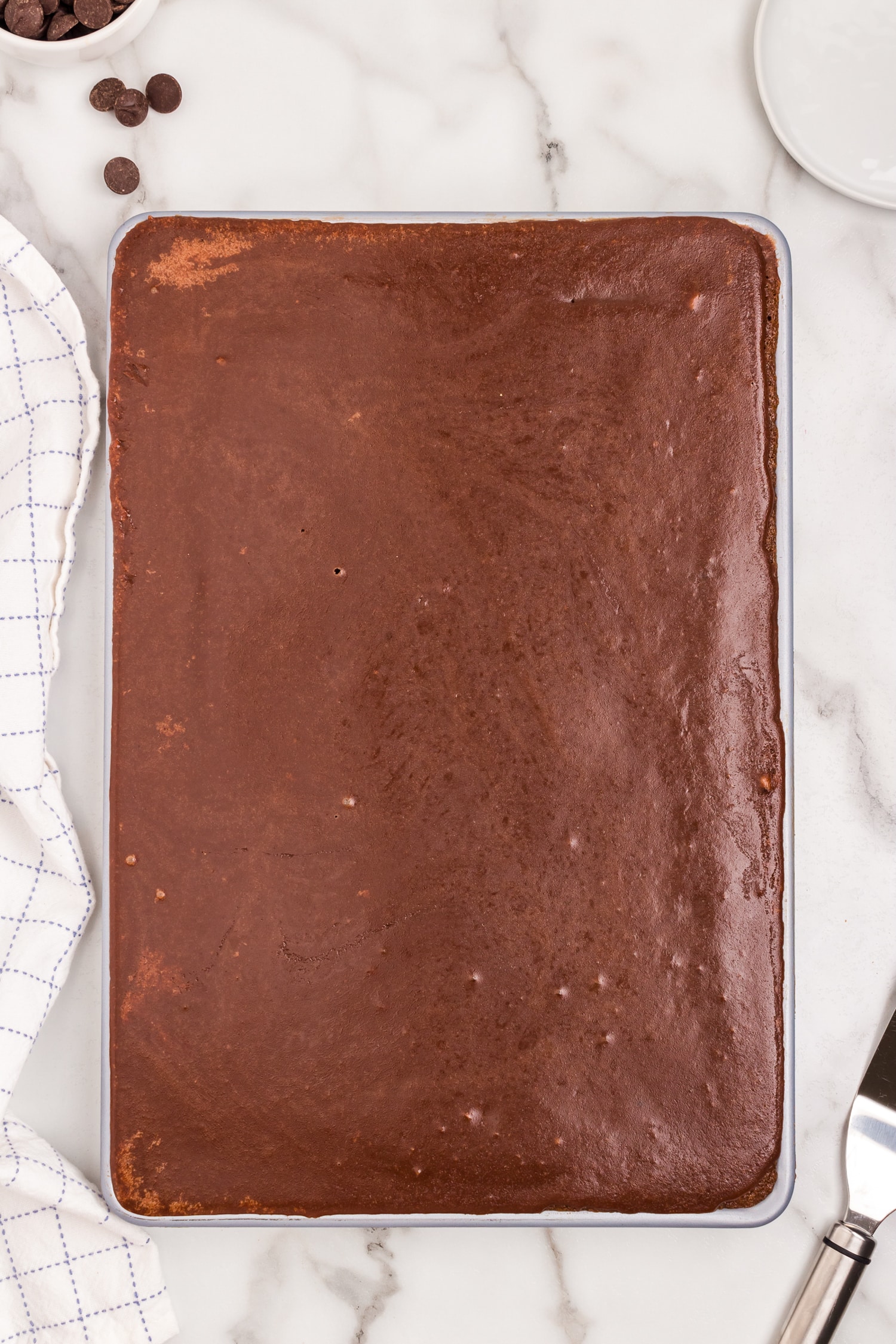 Pour frosting over the brownies when they're still a little warm.