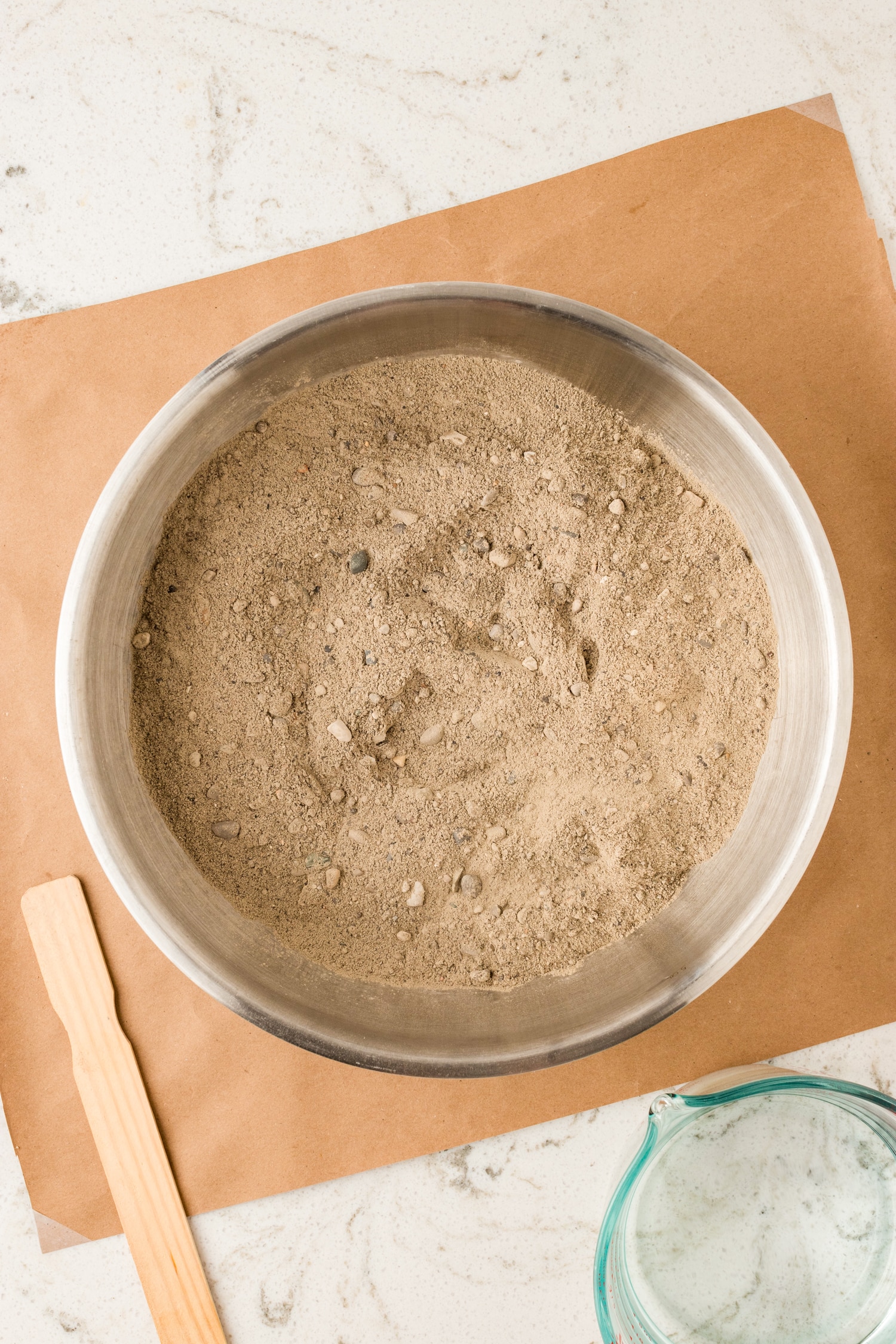 Put 8-10 cups of concrete mix to a bucket.