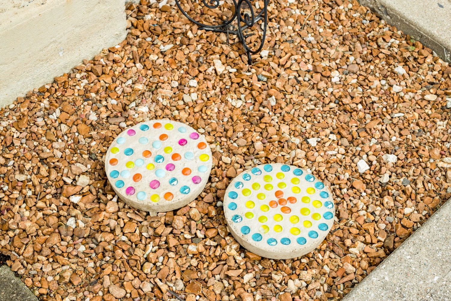 two completed stepping stones in a bed of rocks.