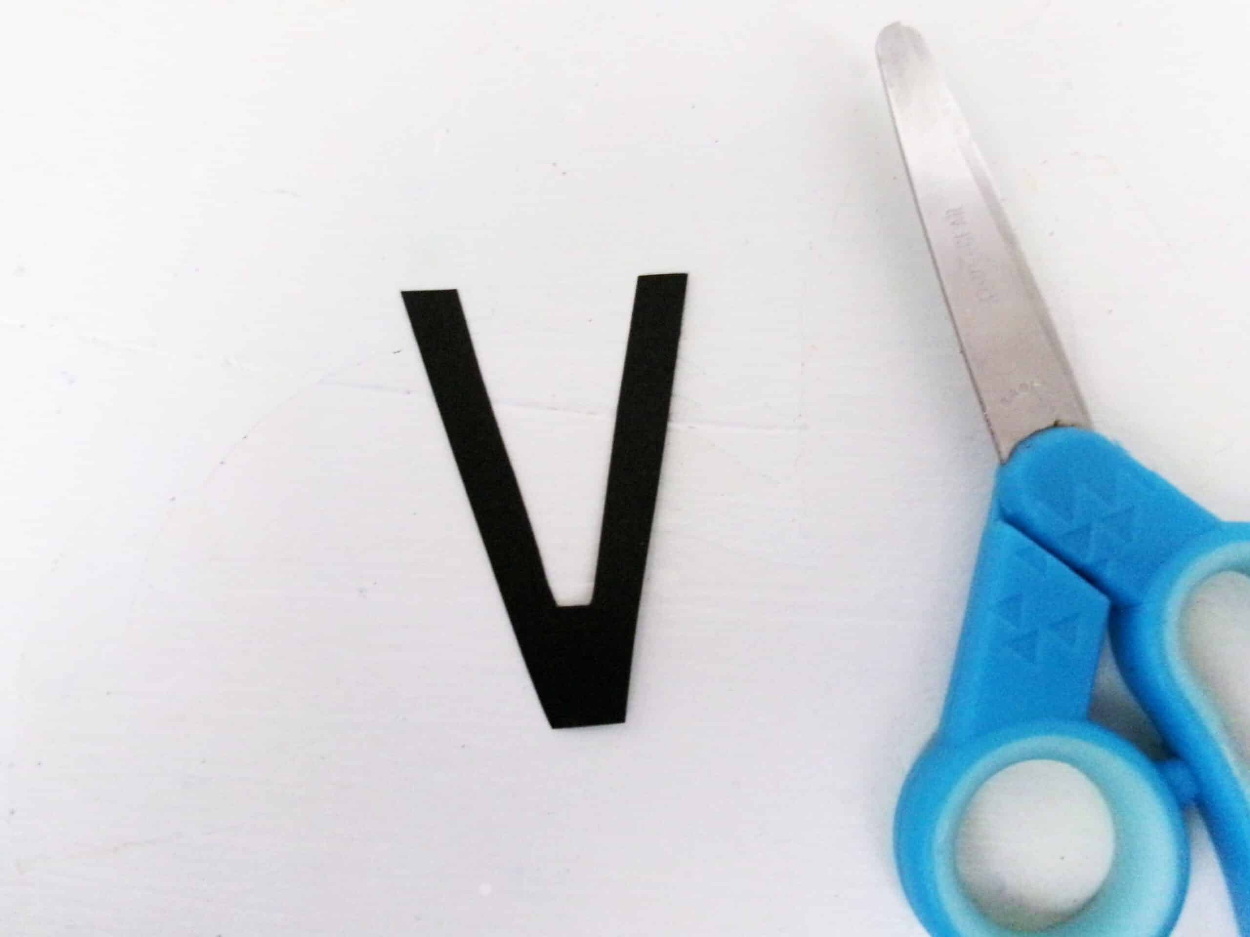 Cut a V out of black cardstock.
