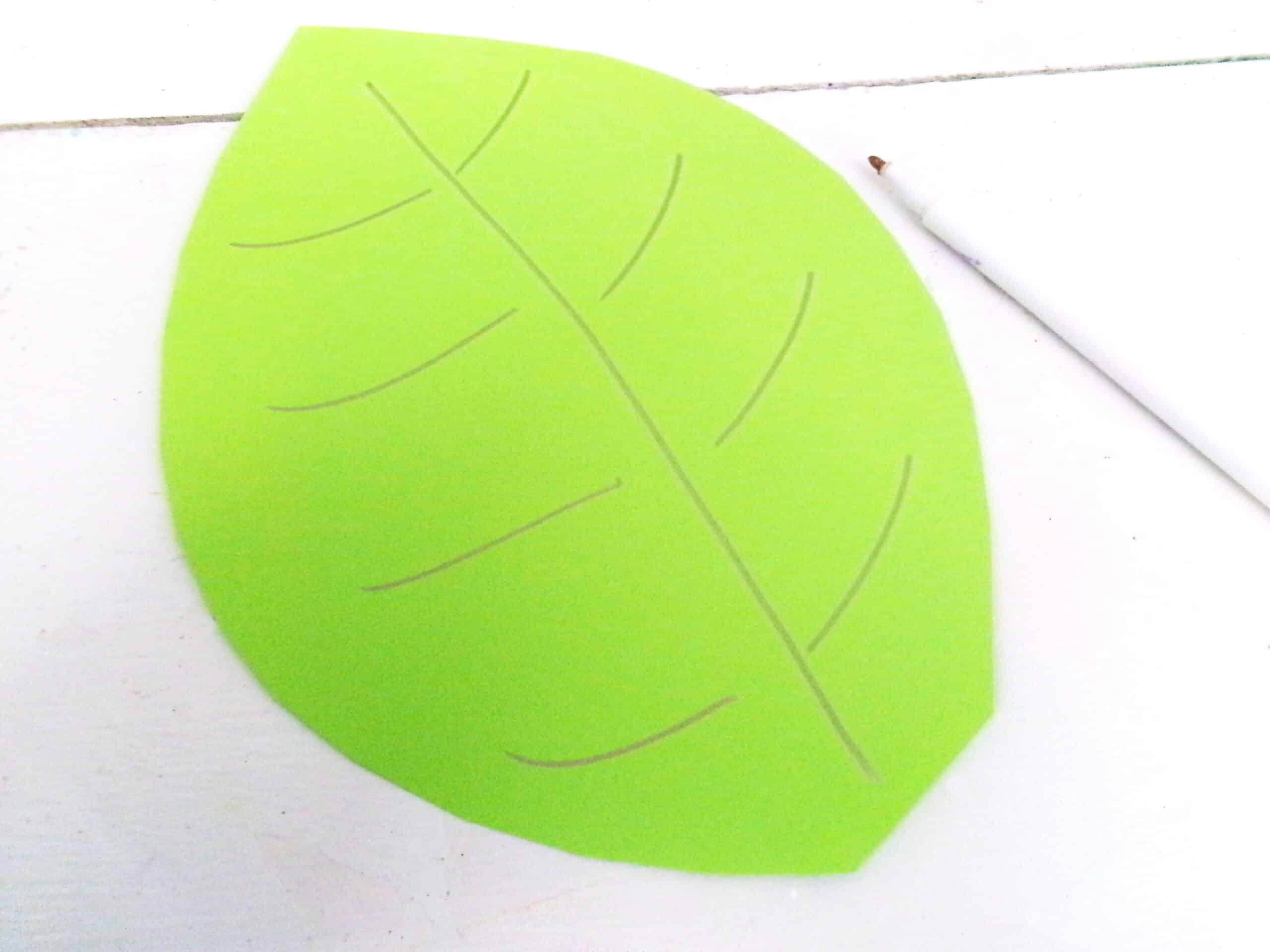 Print the leaf shape and cut from a different shade of green.