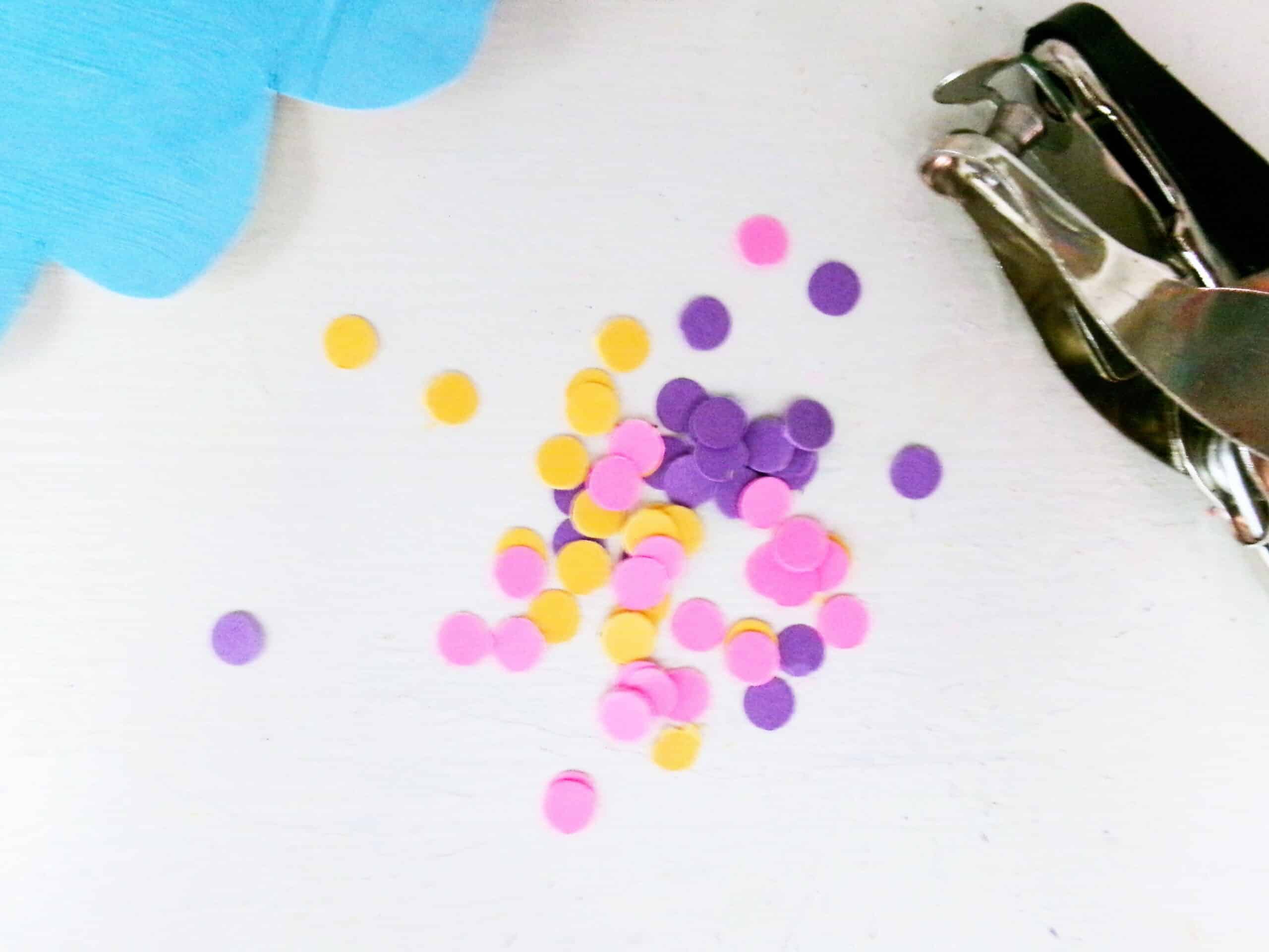 Next use a hole punch & cut out a bunch of different color holes for sprinkles.