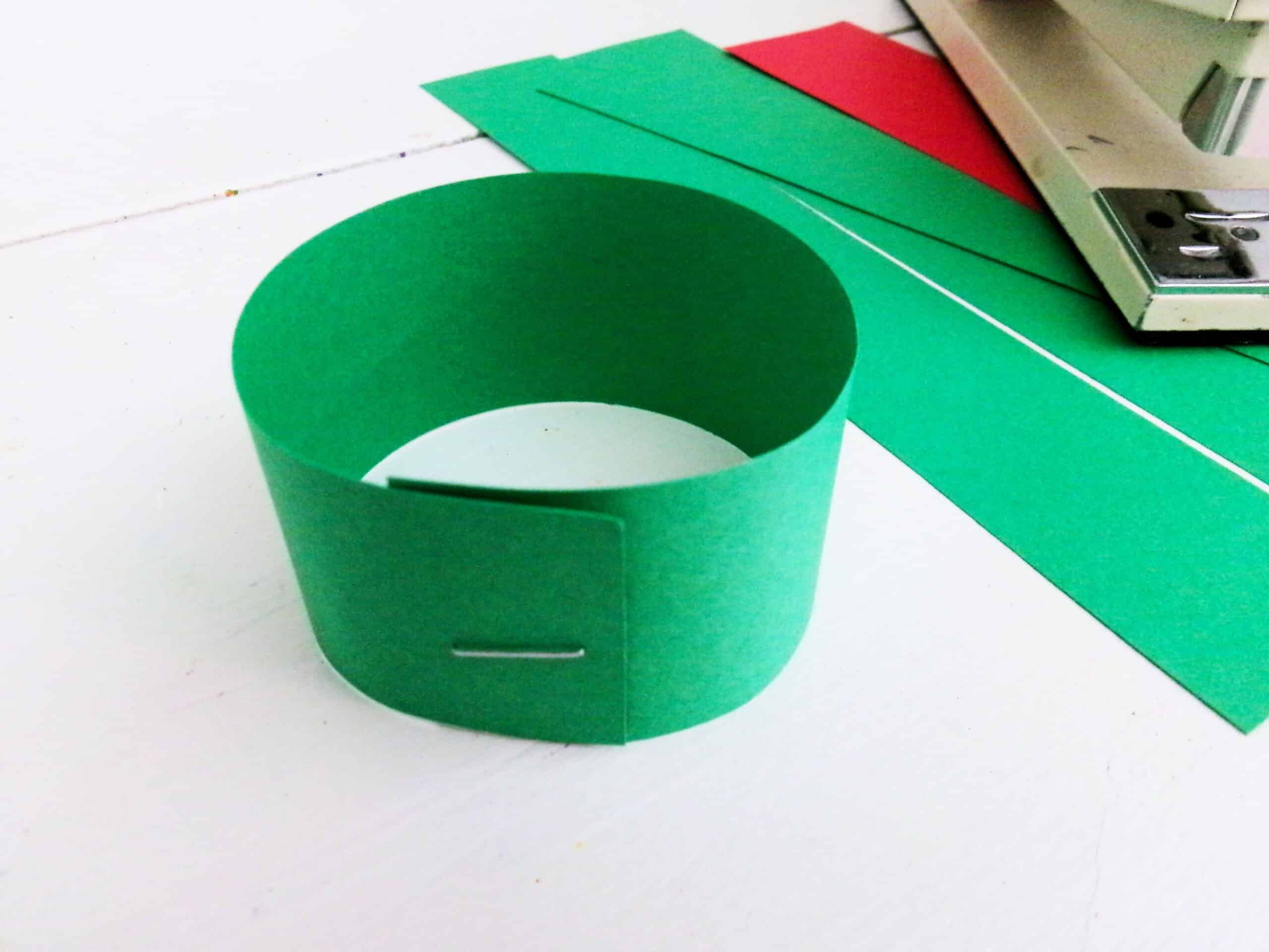 Bring the ends together and staple them together.