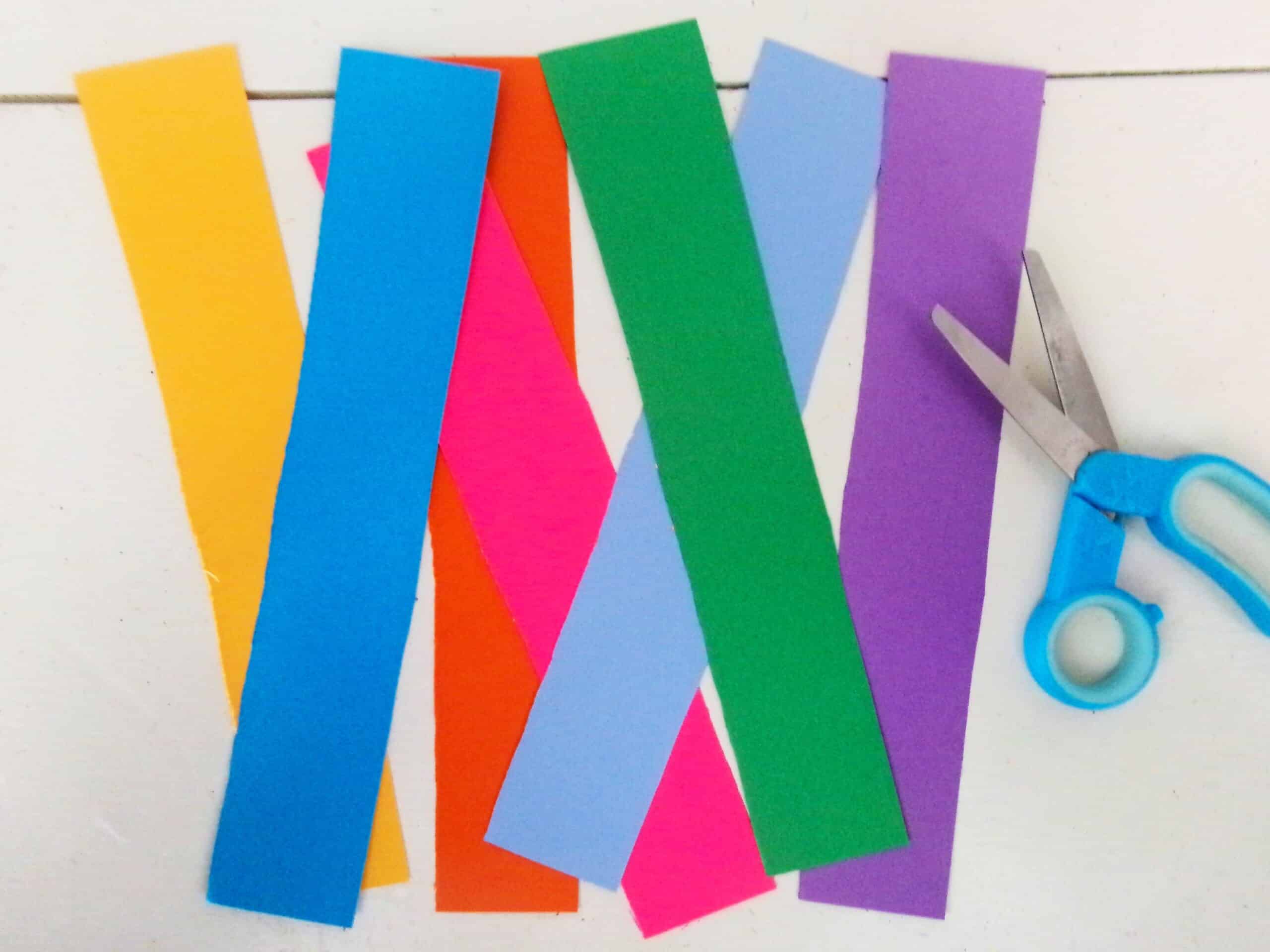 Begin by cutting strips of different color cardstock