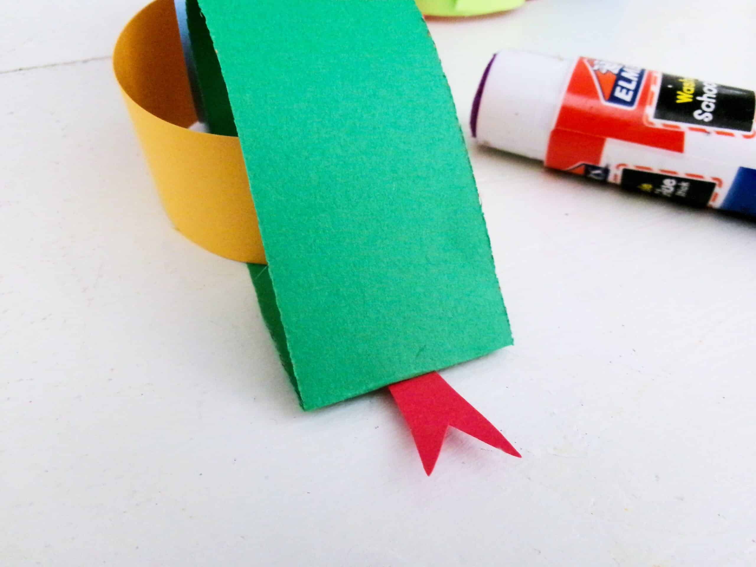 Glue it onto the pinched end to make a tongue for the face.