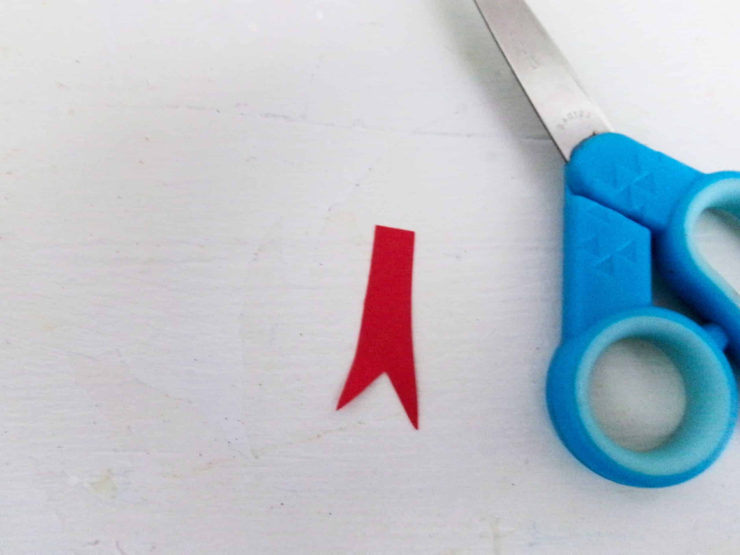 Cut a tongue out of red cardstock paper.