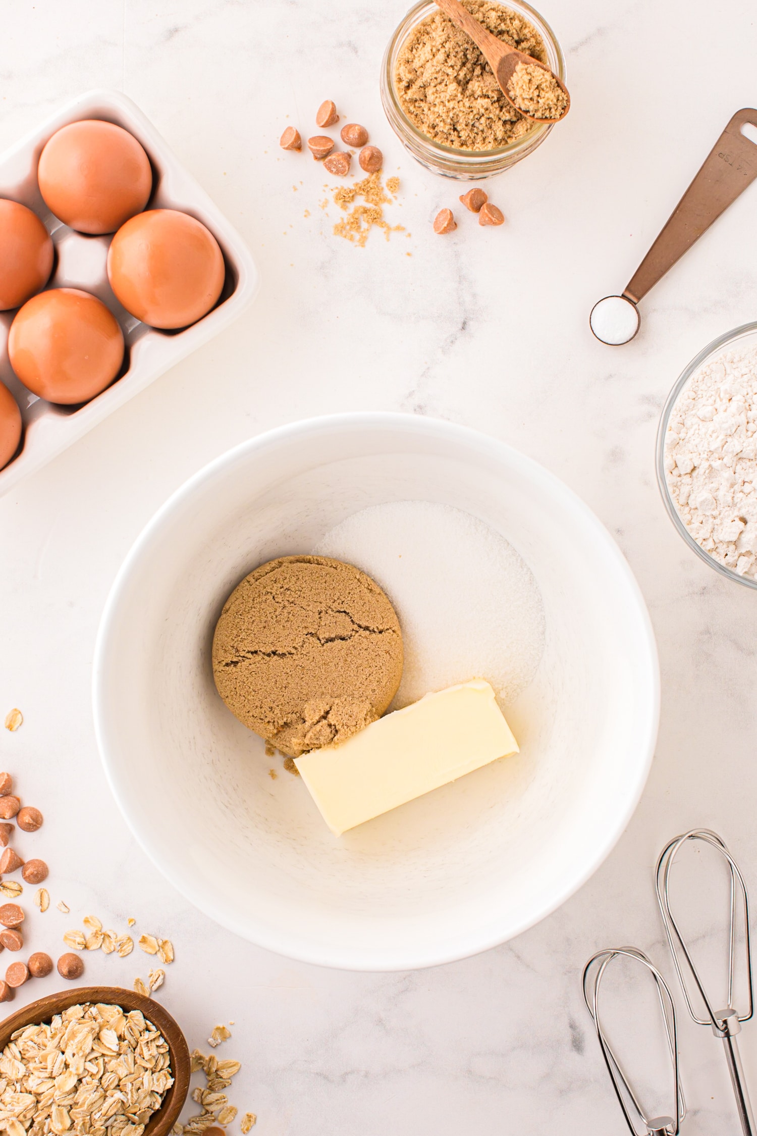 Cream together the butter, brow sugar & white sugar in a large bowl until light and fluffy.