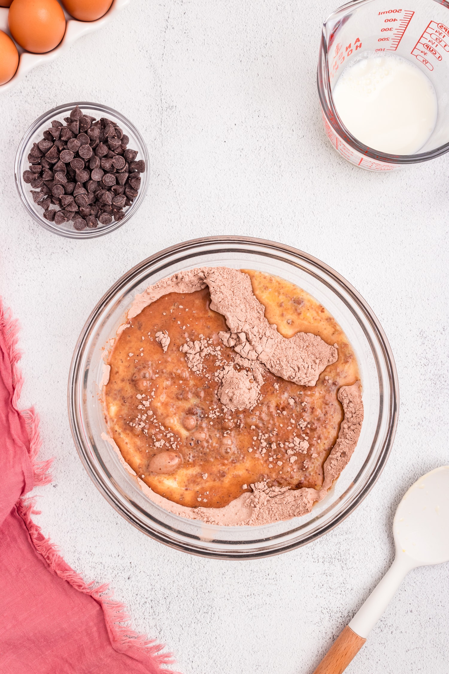 Combining wet and dry ingredients in mixing bowl for Chocolate Pancakes