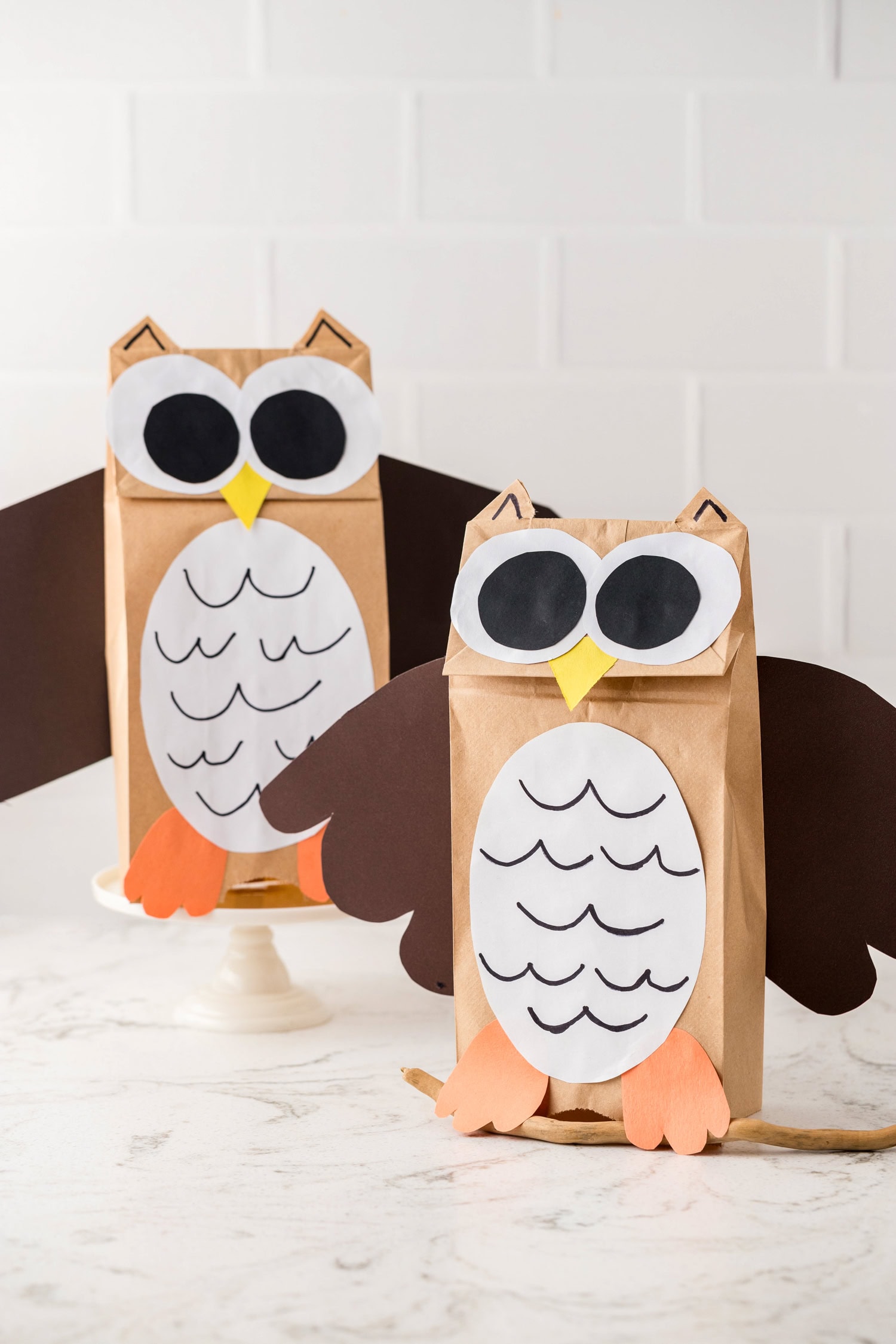 Opening the paper bag so the Paper Bag Owl Craft stands on its own