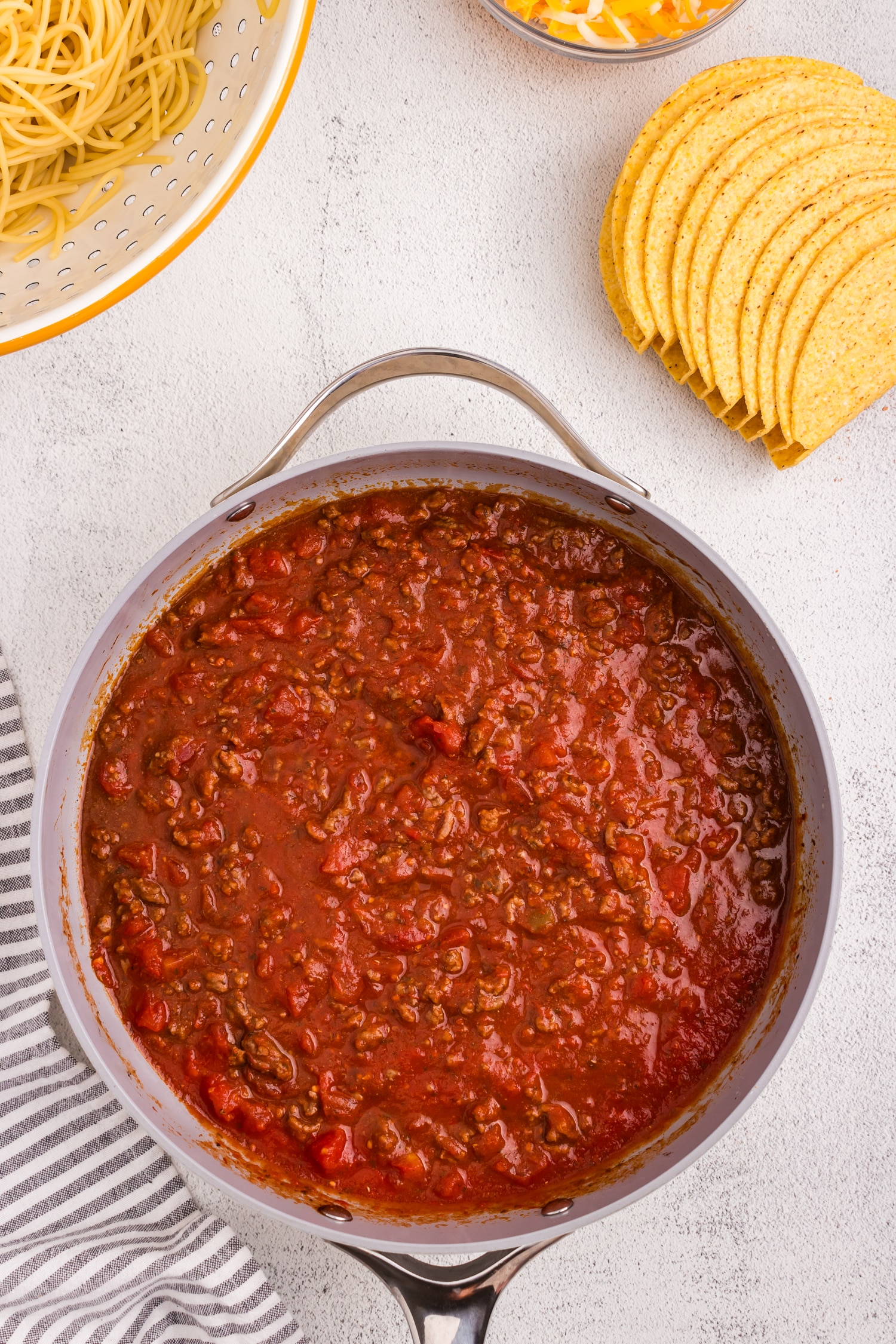 Combined seasoned meat in skillet for Spaghetti Tacos