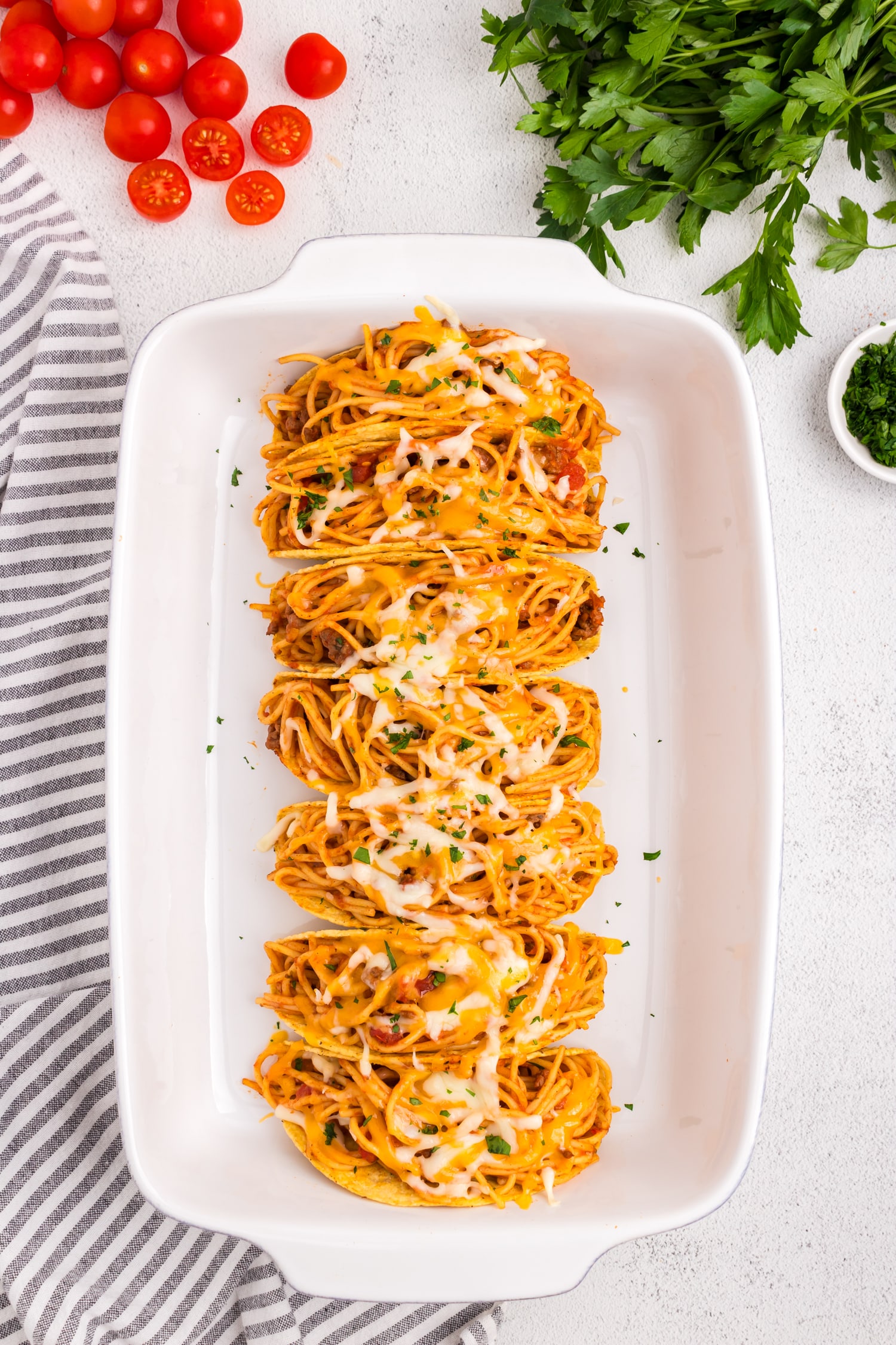 Spaghetti Tacos hot out of the oven with melted cheese overtop
