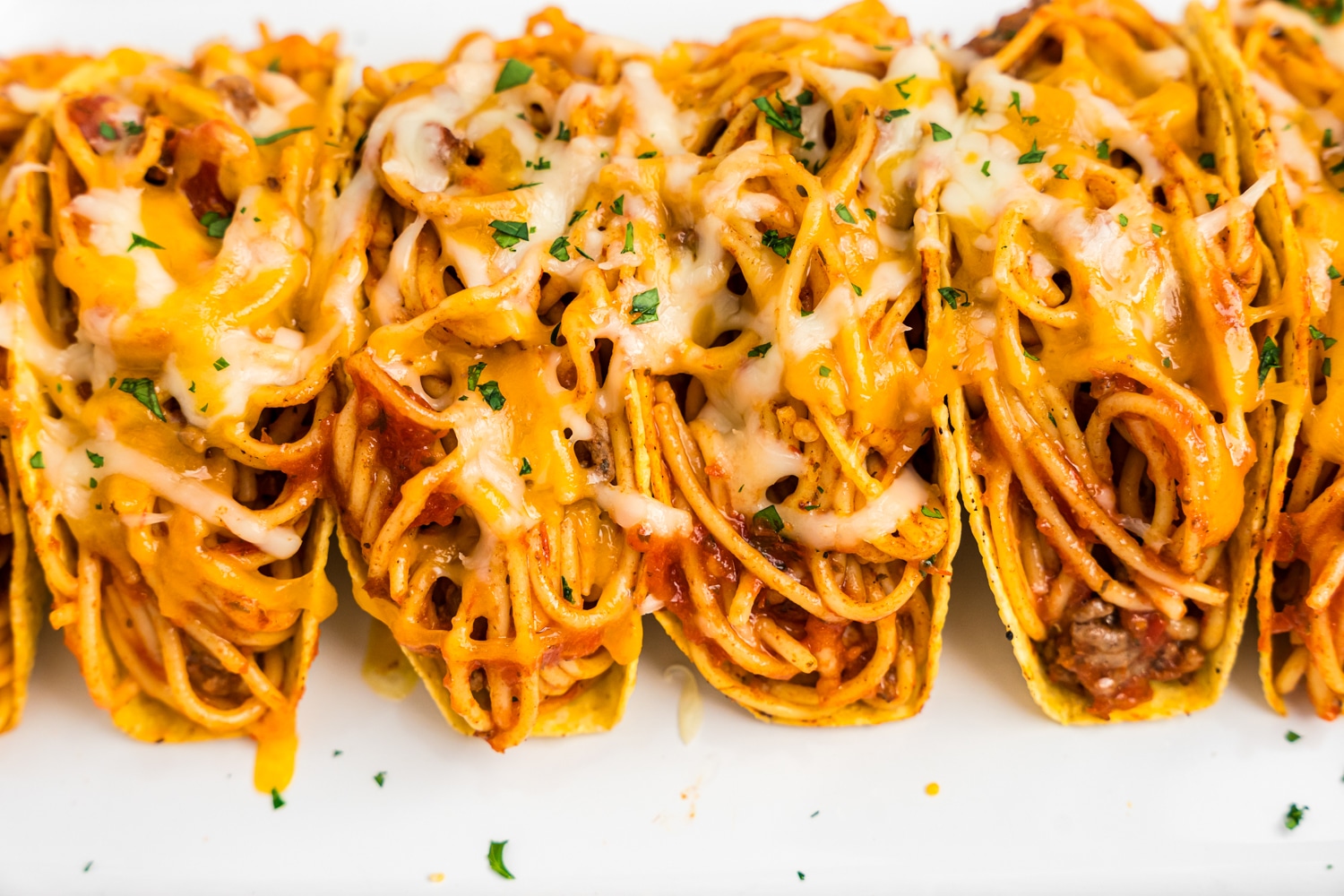 Spaghetti Tacos arranged on serving plate