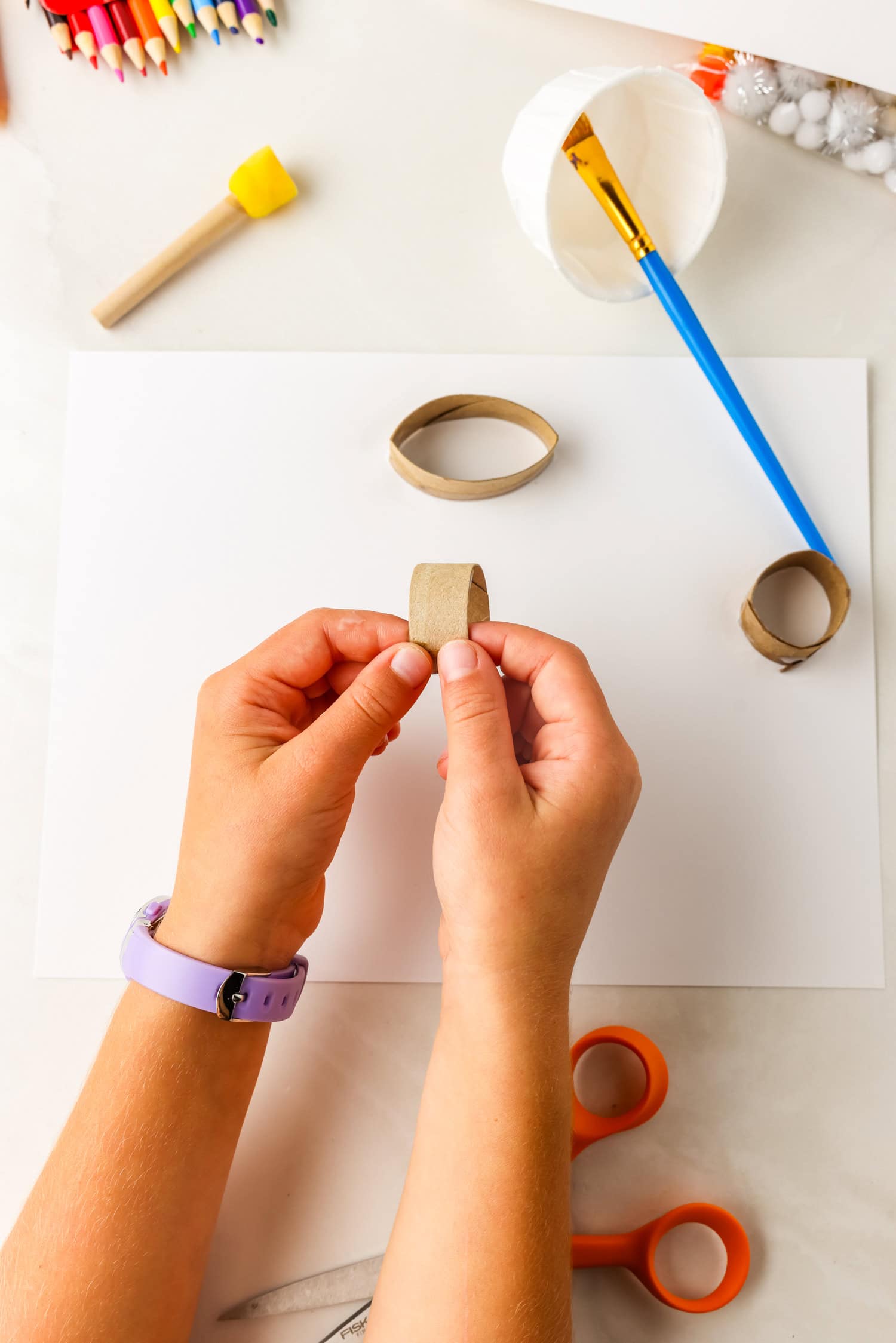 Wrapping toilet paper tube pieces for Butterfly Life Cycle Craft