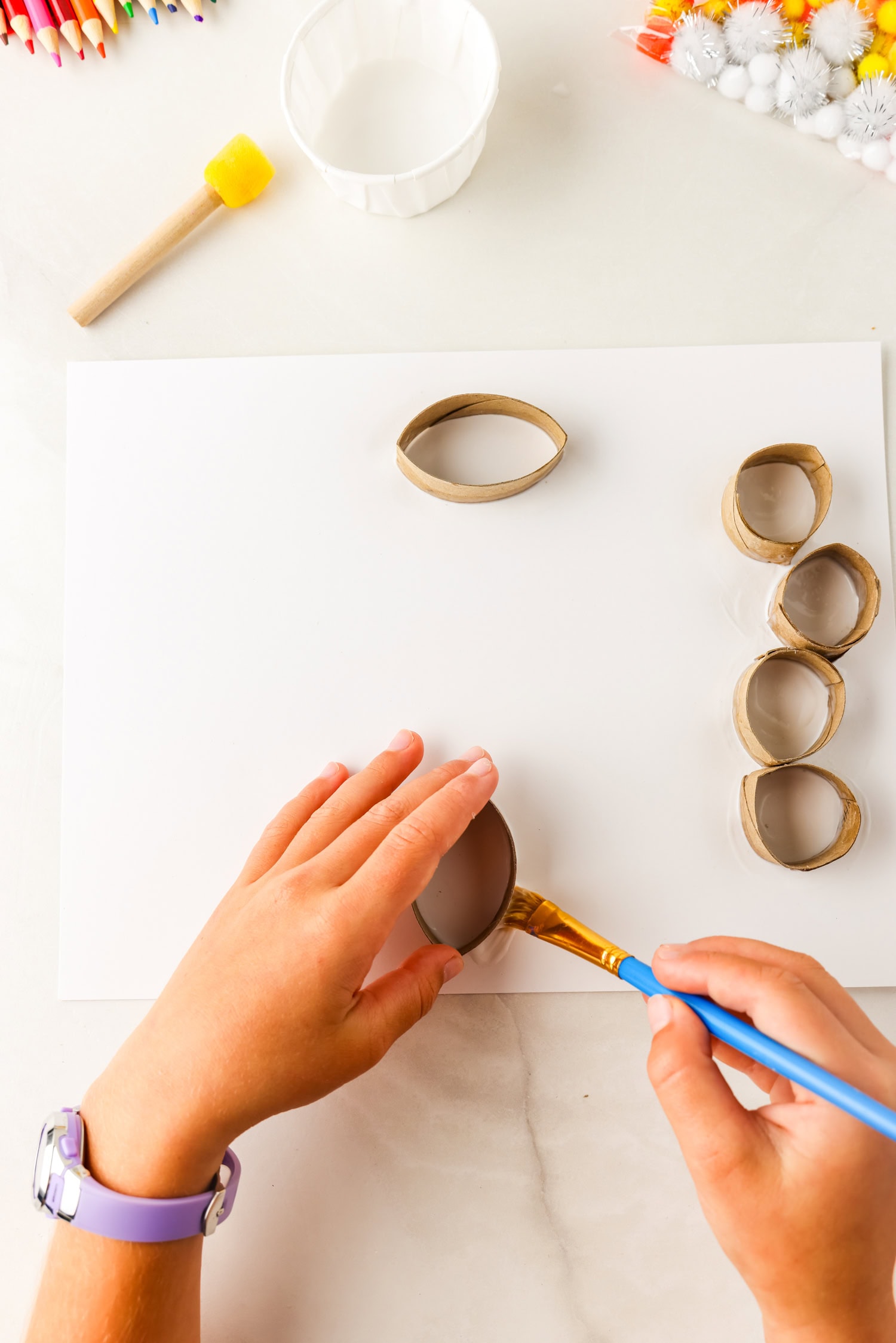 Bending toilet paper tube to be elongated for butterfly wing for Butterfly Life Cycle Craft