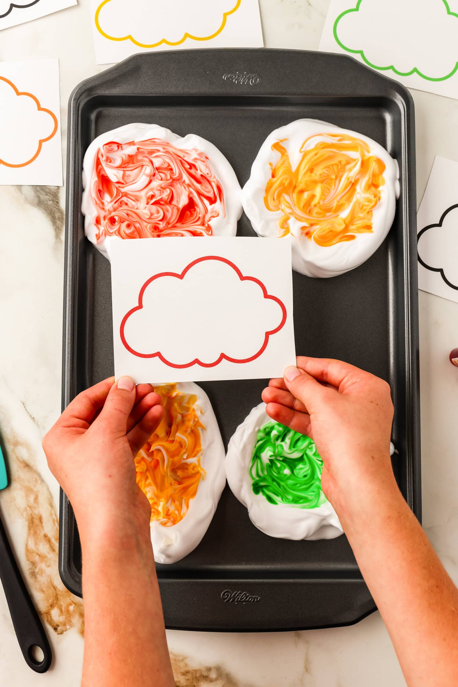 The cloud printable cut out prior to pressing into colored shaving cream for Toilet Paper Roll Fall Tree Craft