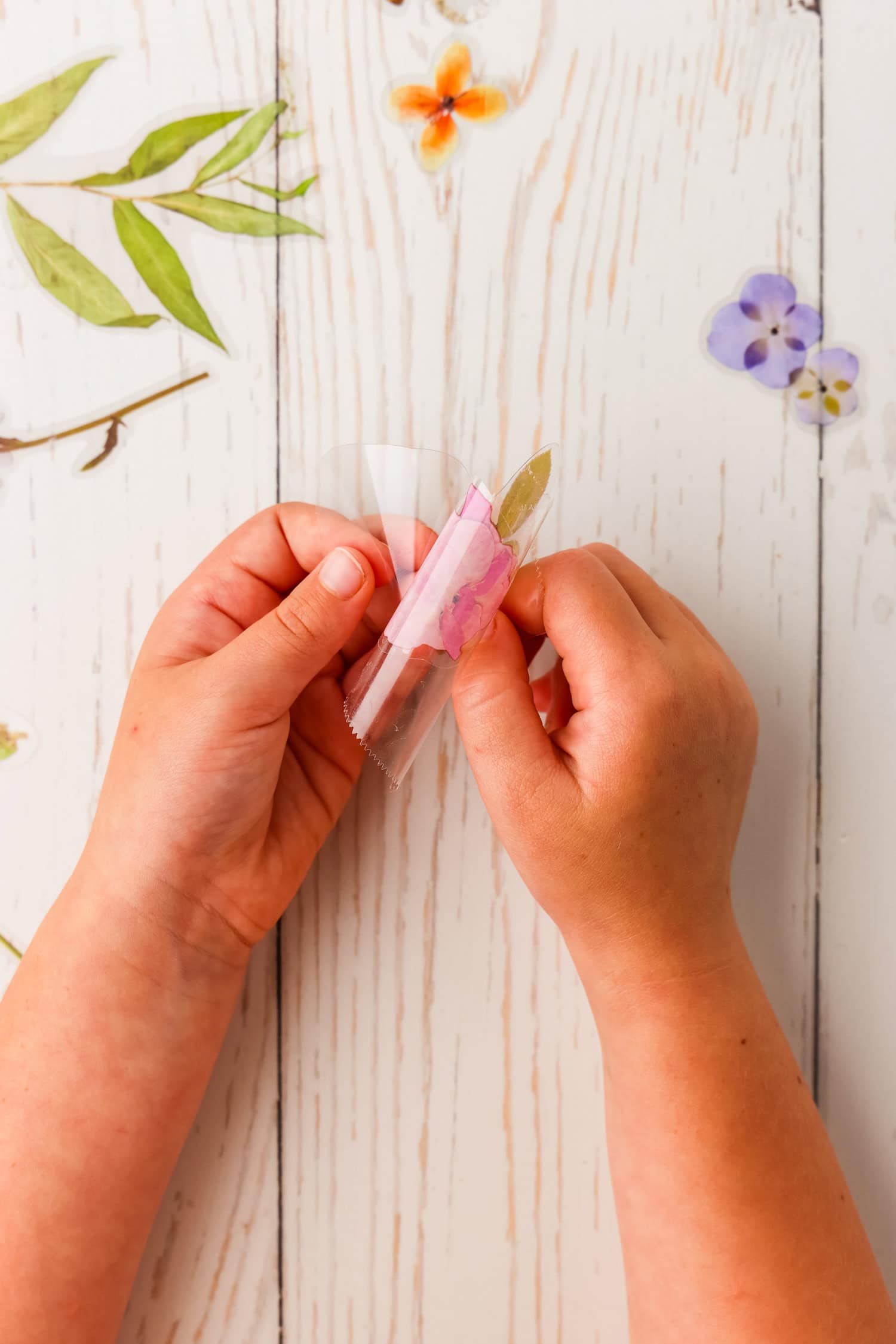 Peeling the backing of a clear sticker for the DIY Sticker Book