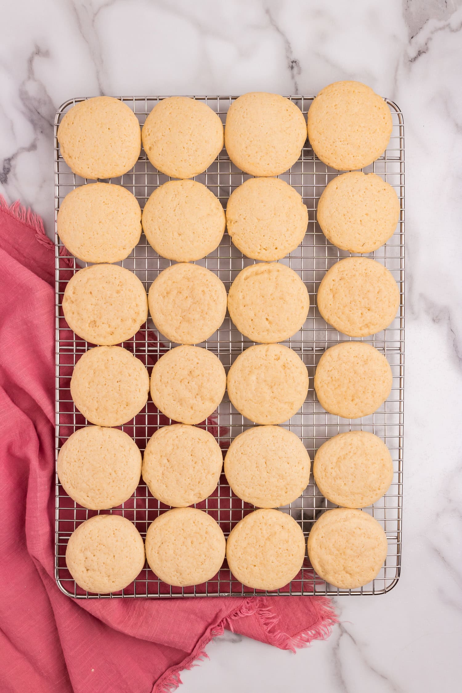 Sour Cream Cookies baked to a golden brown cooling on wire rack