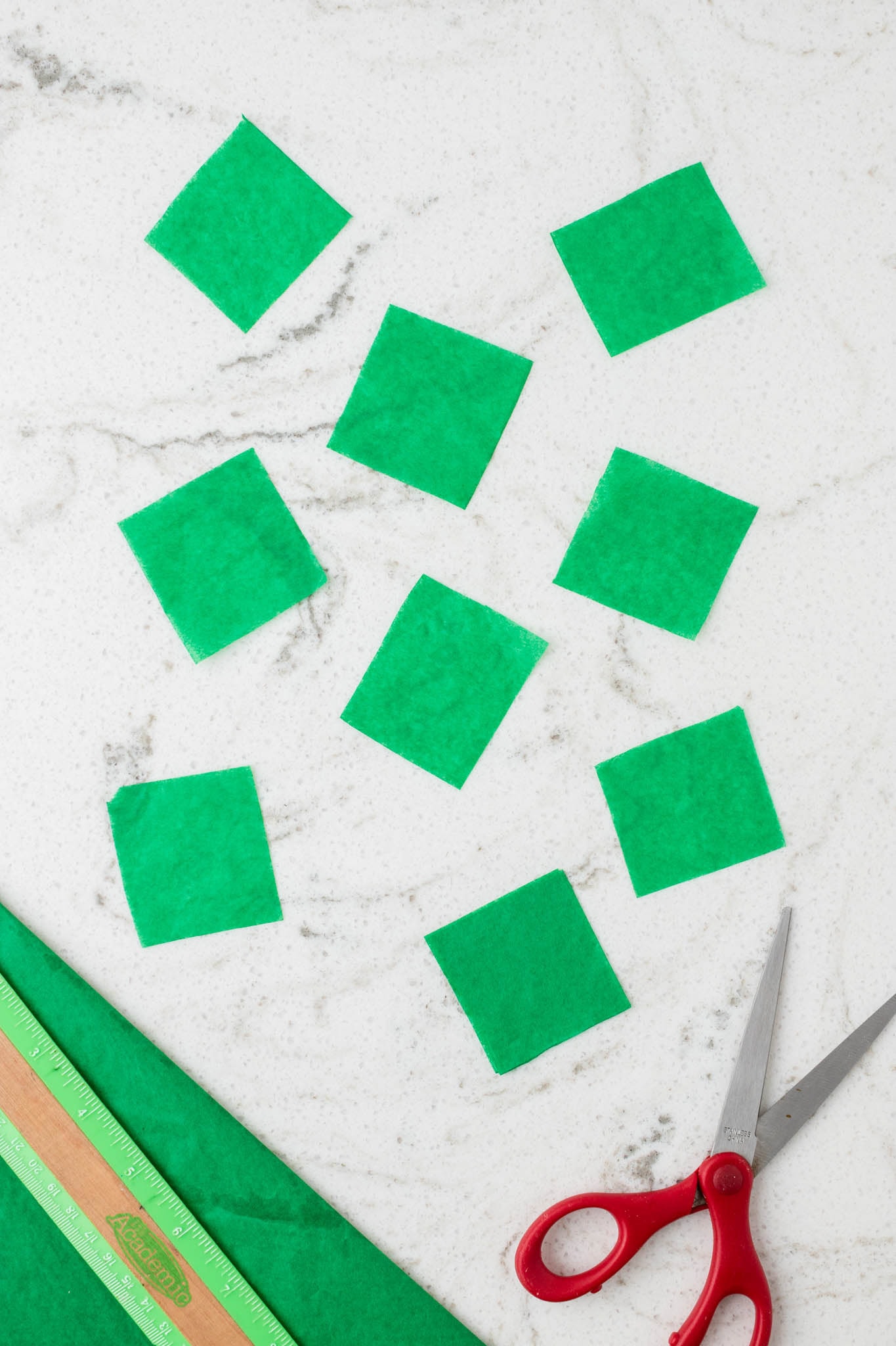 Overhead picture of tissue paper cut into squares.