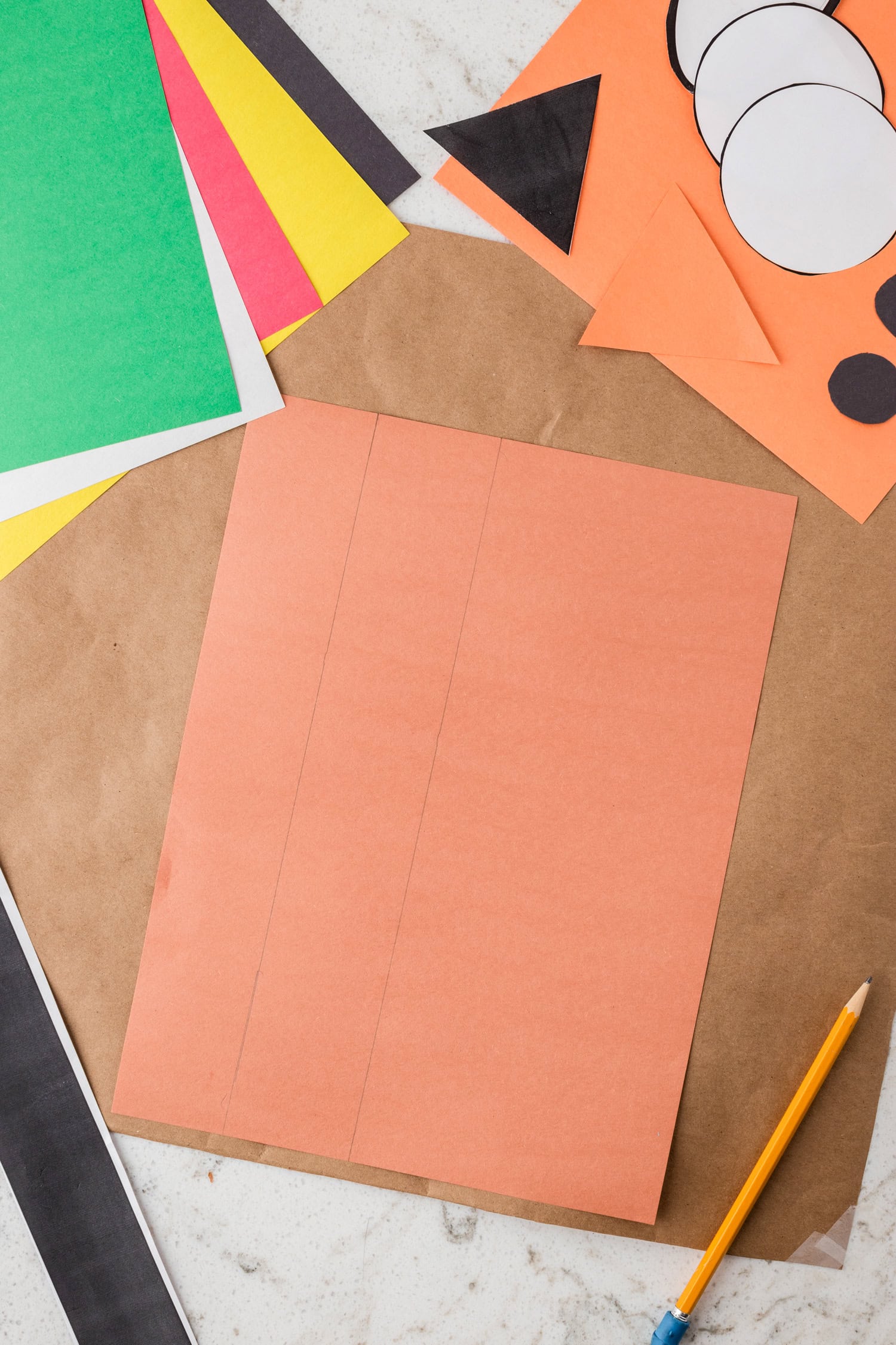 Tracing parts of Turkey Headband Craft onto construction paper