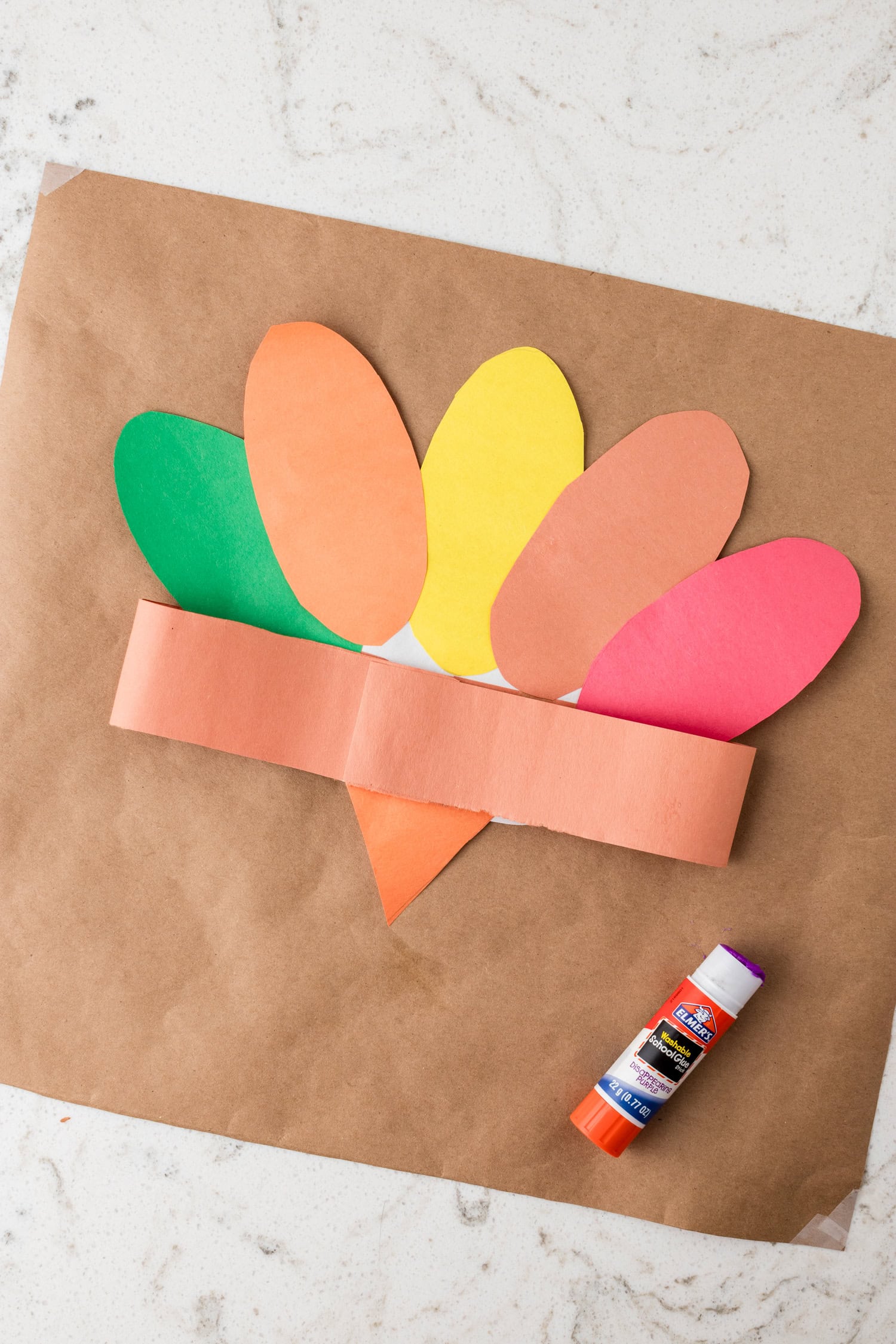 Securing the headband ends together with glue for the Turkey Headband Craft
