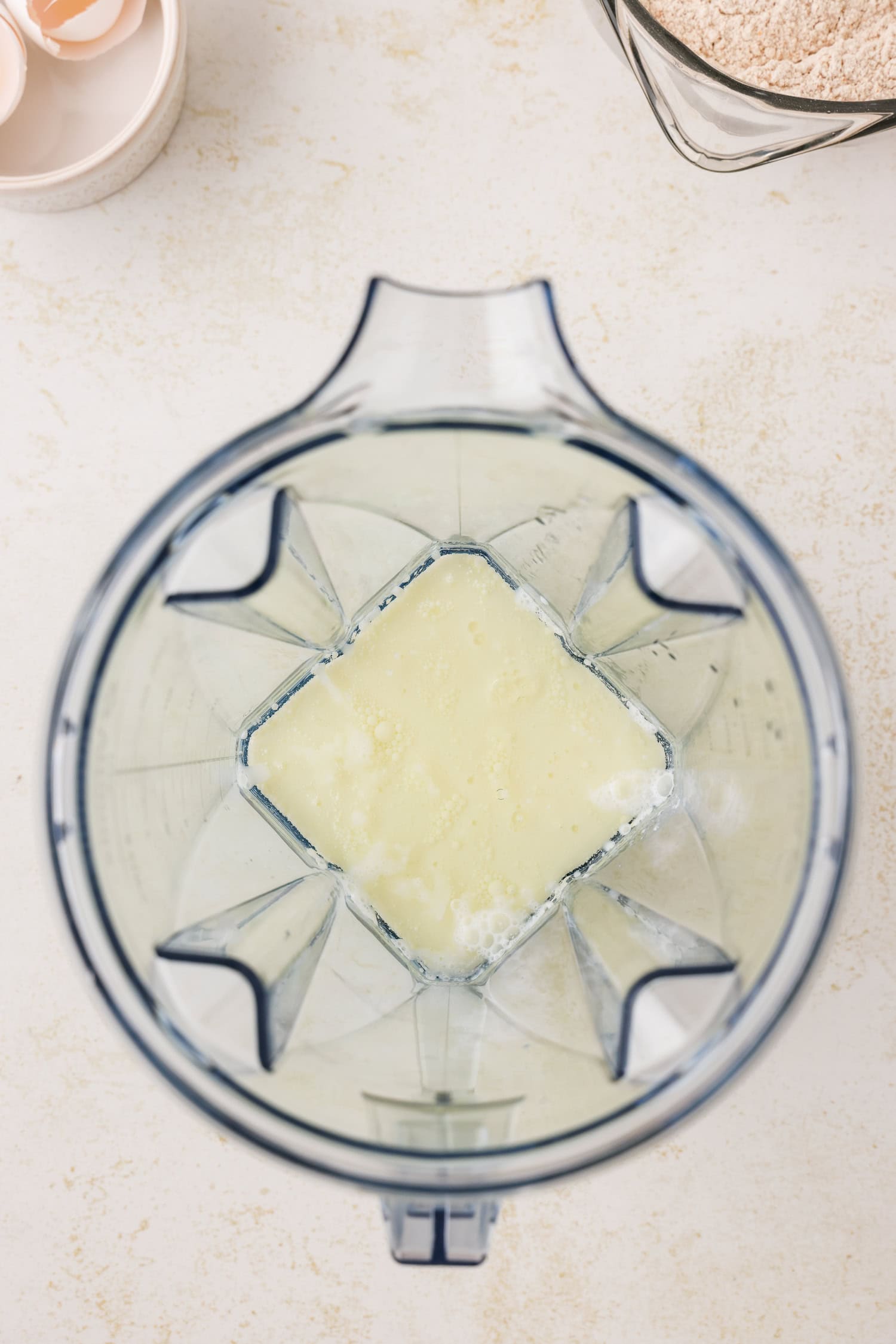 Blender with wet ingredients in it.