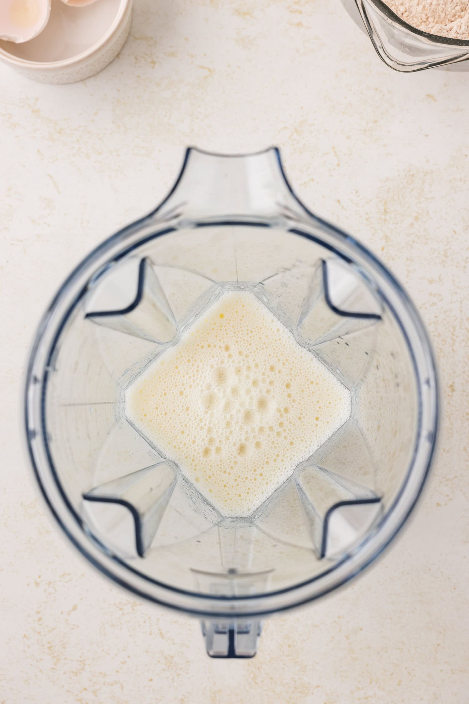 Blender with wet ingredients in it.