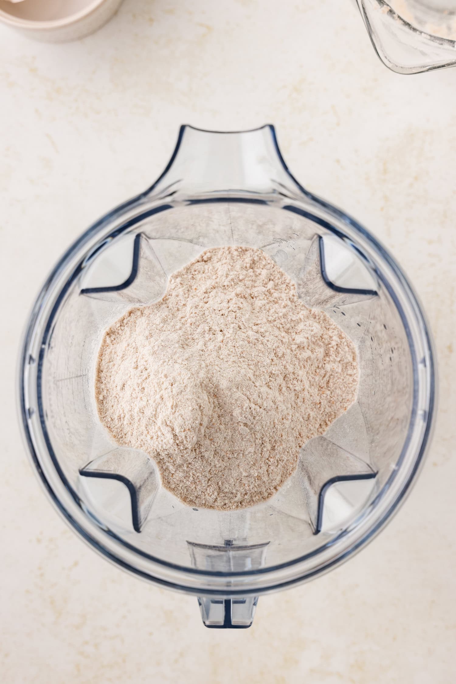 Blender with combined dry ingredients in it.