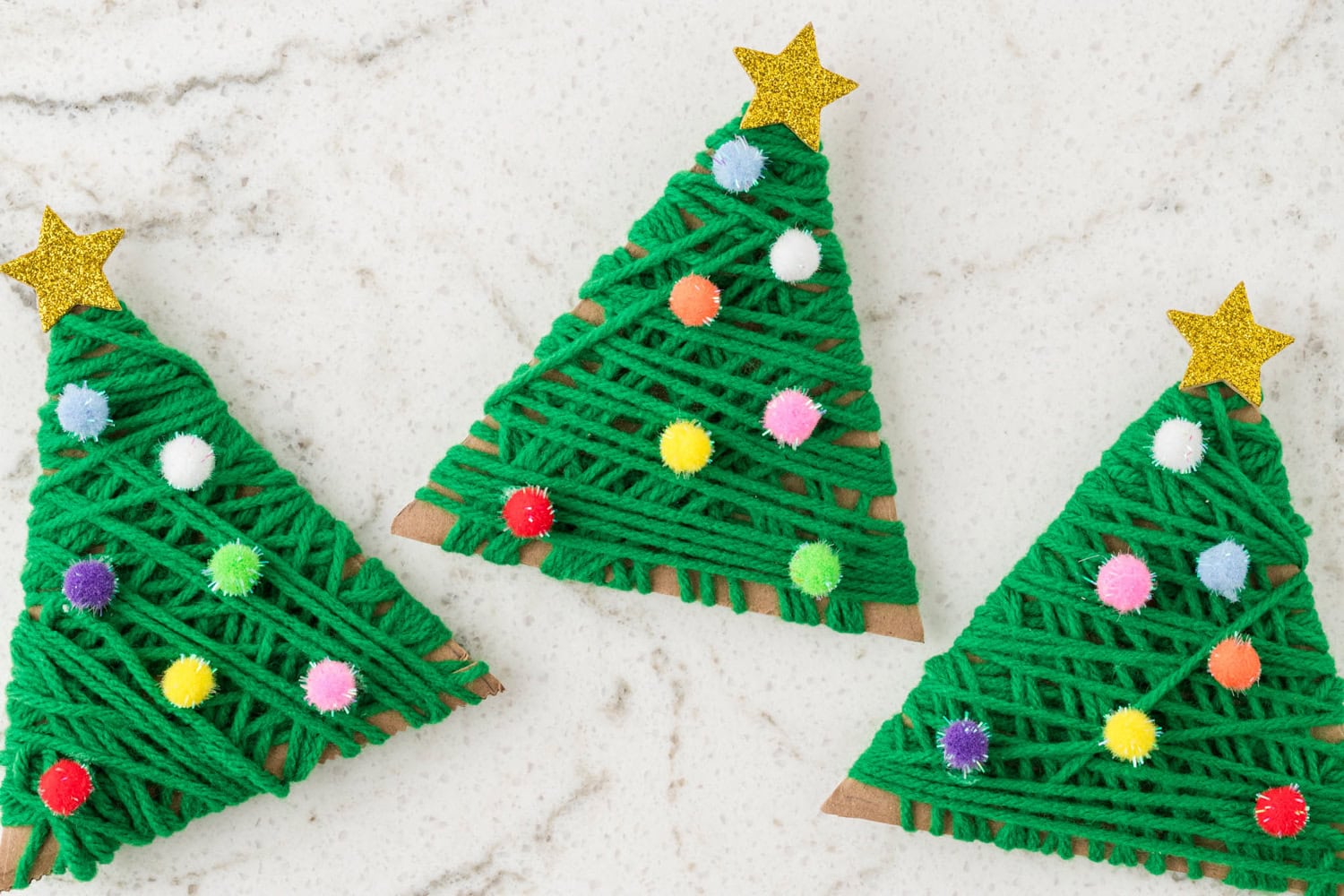 Overhead picture of three completed Yarn Wrapped Christmas Trees.