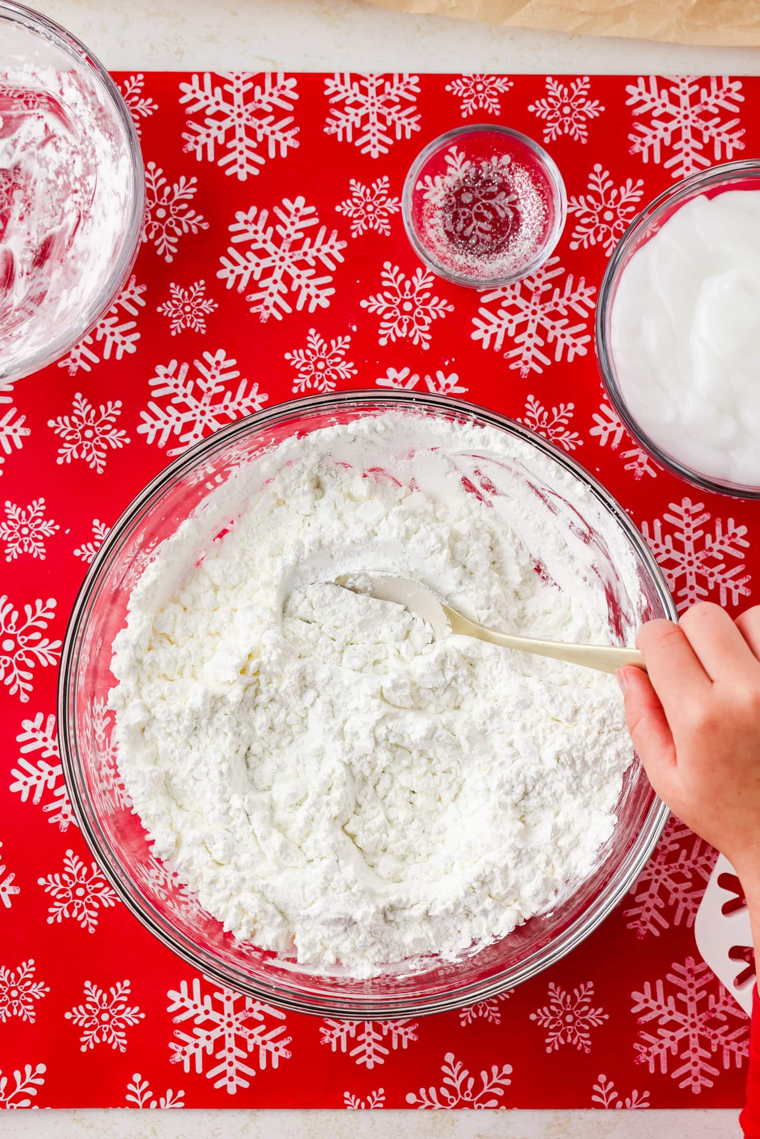 Overhead picture of flour and glitter being mixed together.