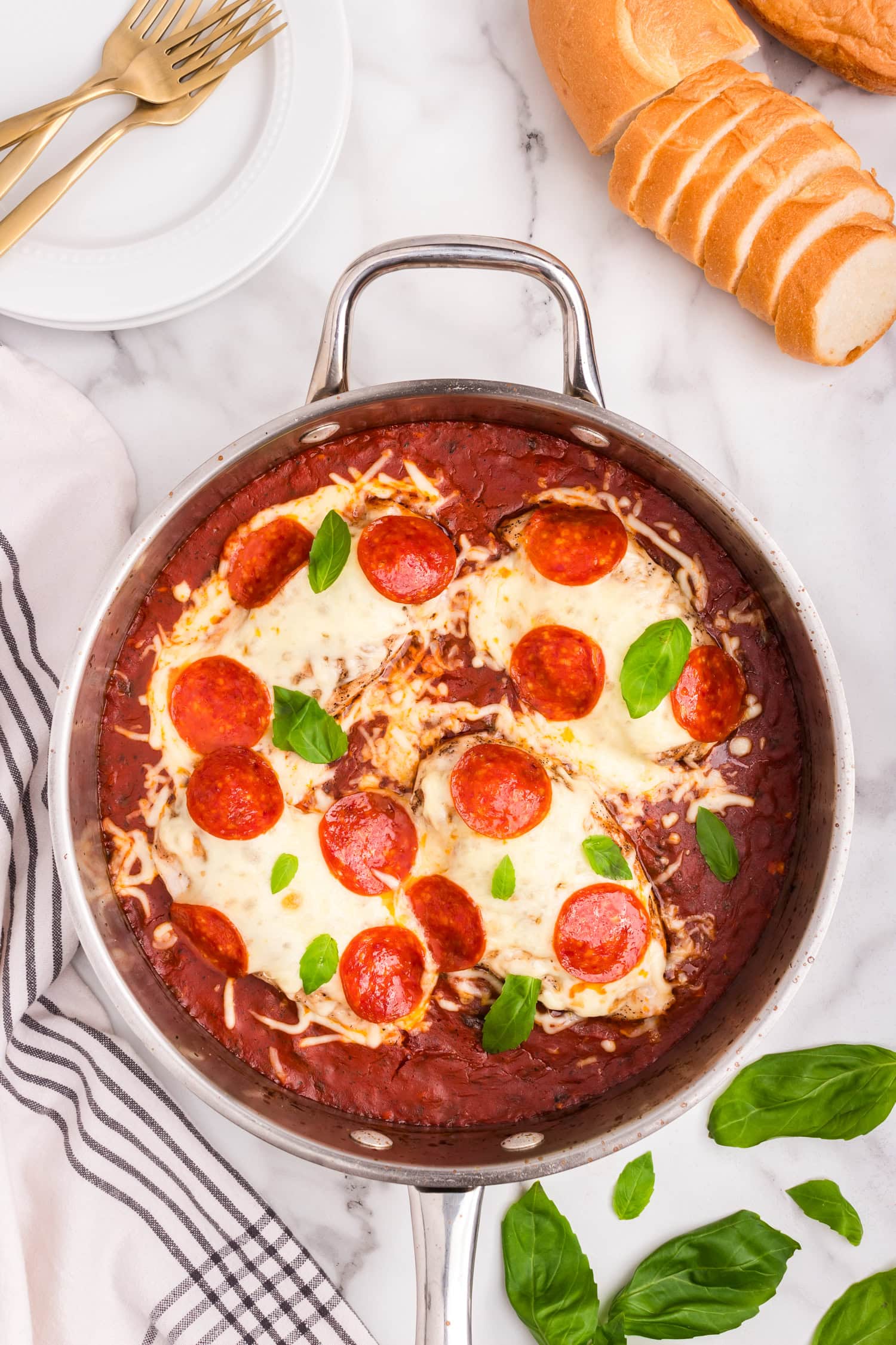 Overhead picture of completed pizza chicken in a pan.