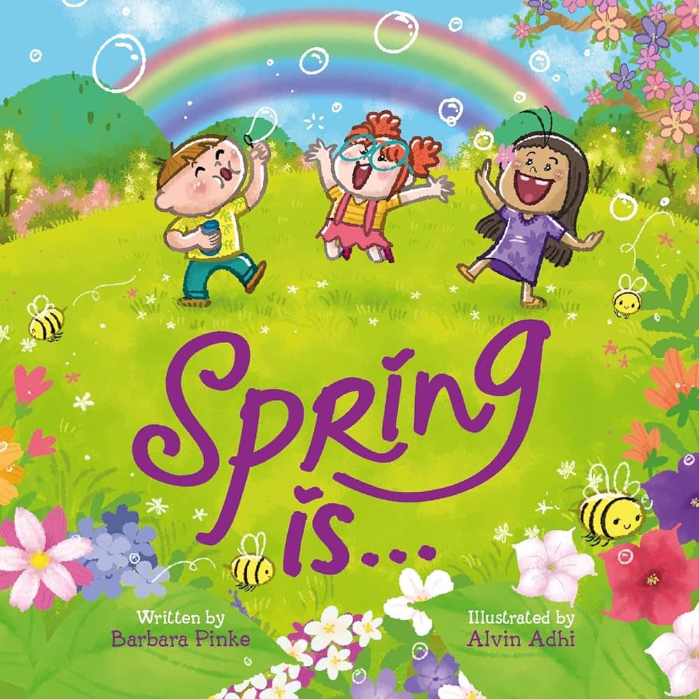 Colorful book cover of *Spring Is...* written by Barbara Pinke and illustrated by Alvin Adhi. The illustration features three joyful children playing in a vibrant spring meadow filled with blooming flowers, buzzing bees, and floating bubbles. A rainbow arches across the bright blue sky, adding to the cheerful and lively atmosphere.