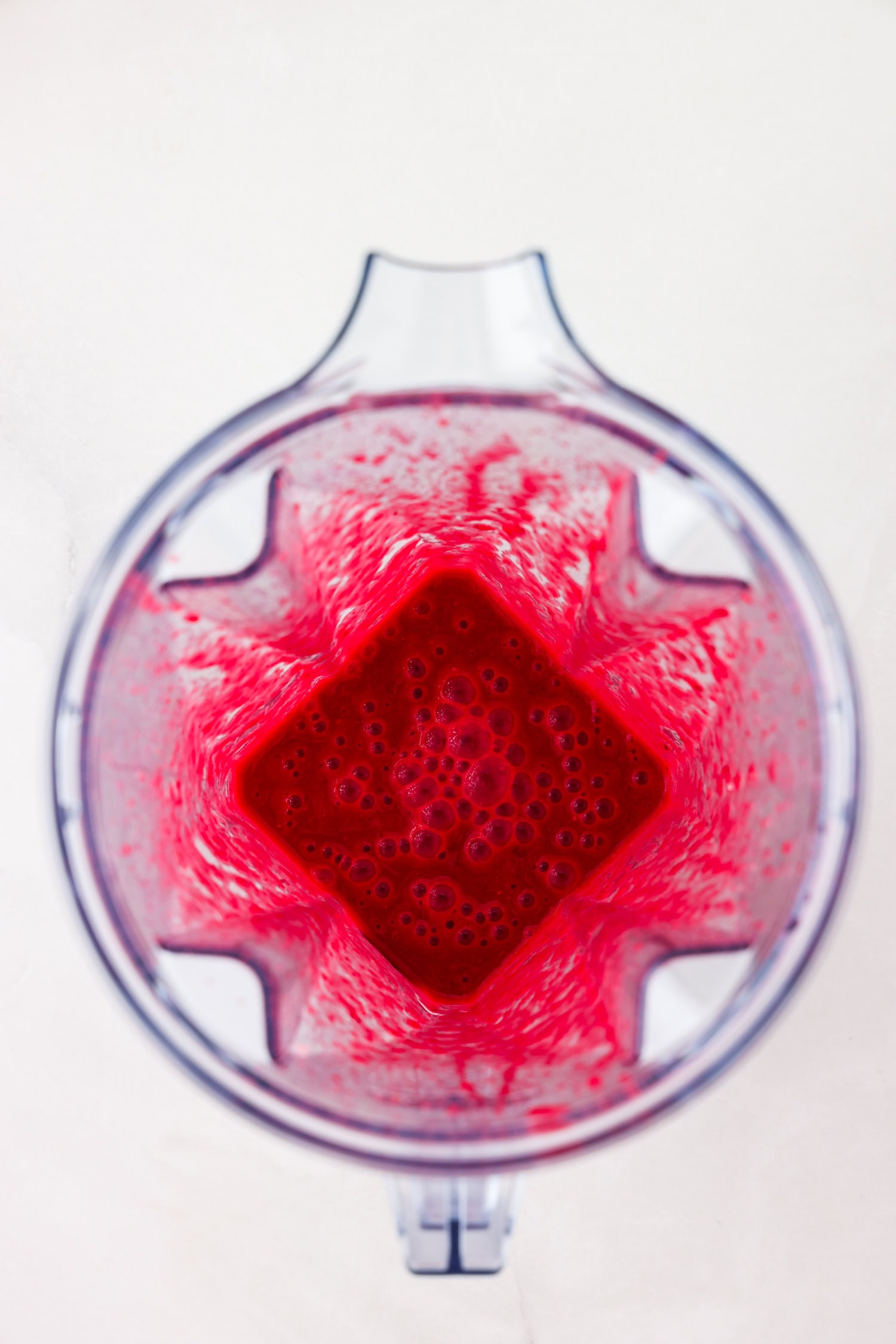 Red fruit mixture blended.
