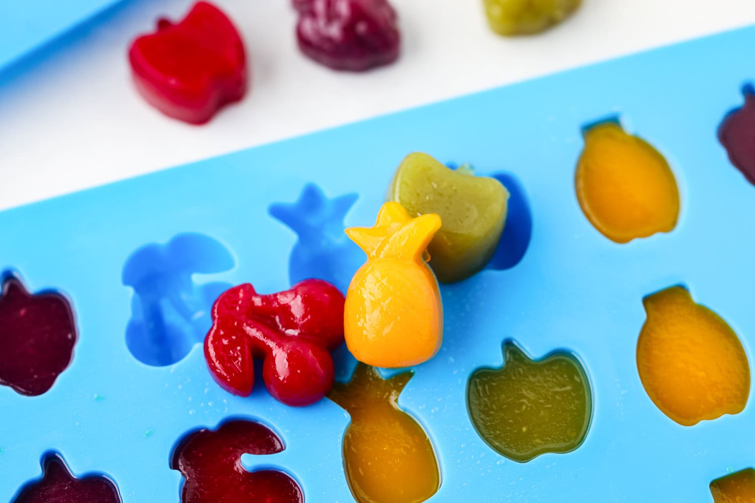 Picture of fruit snacks on top of the blue fruit snack mold.