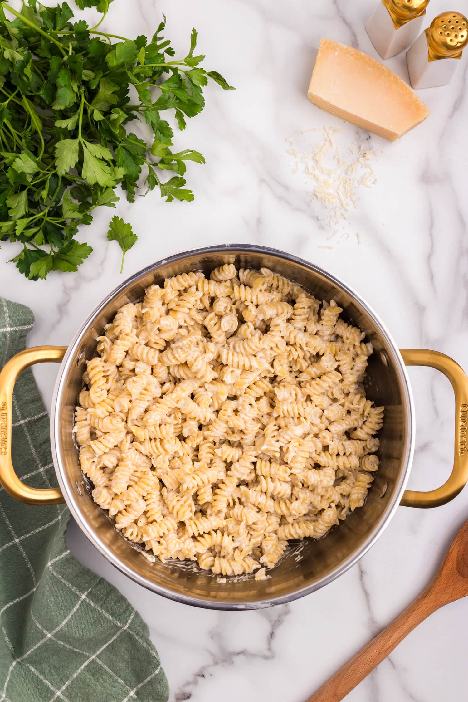 Creamy and well-mixed rotini pasta in a pot, with the seasonings fully incorporated into the cheese sauce.