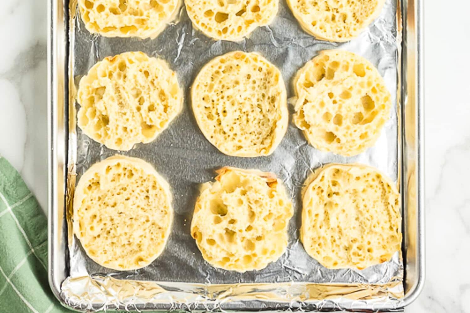 Sheet pan with English muffins split open