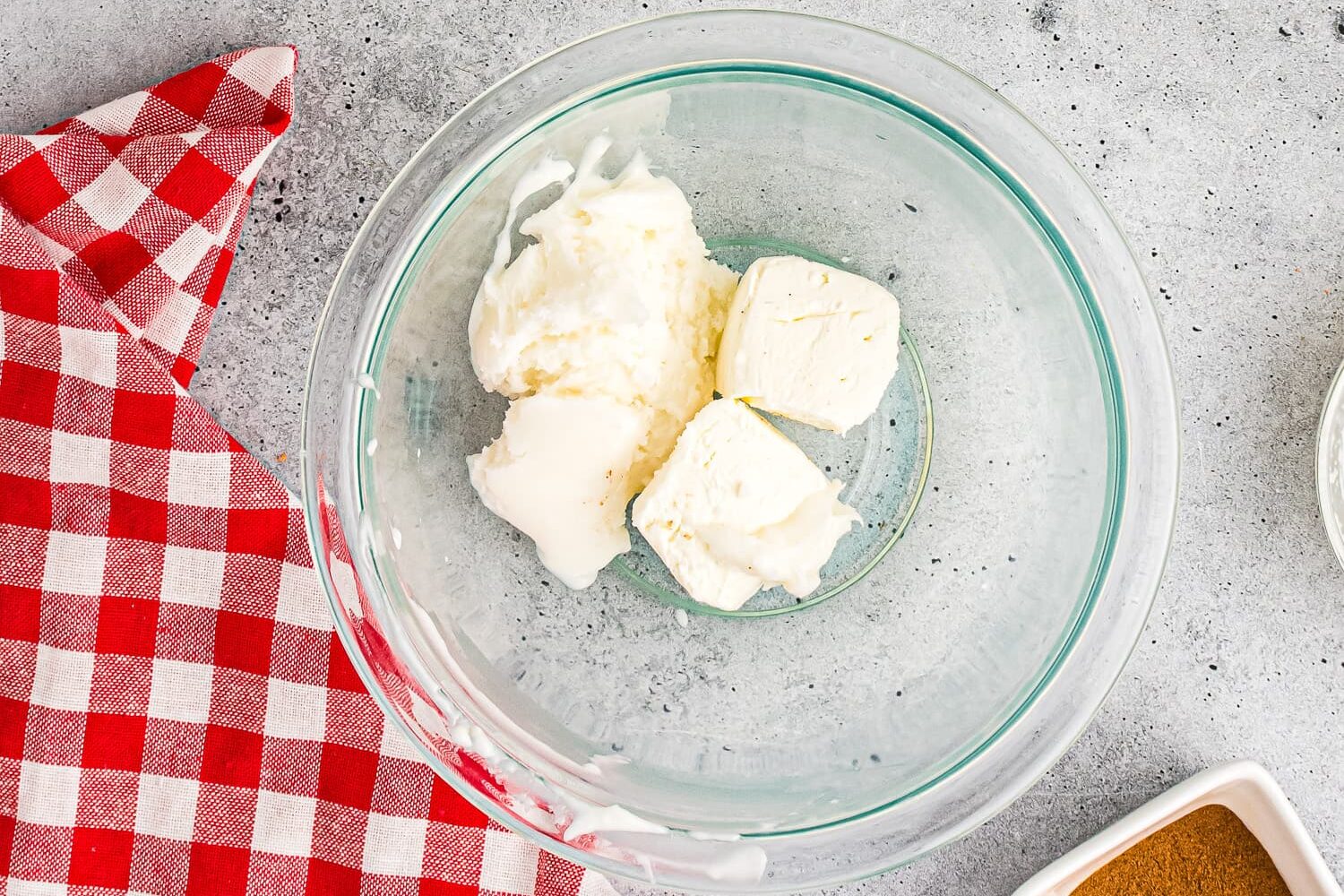 Bowl with cream cheese and powdered sugar