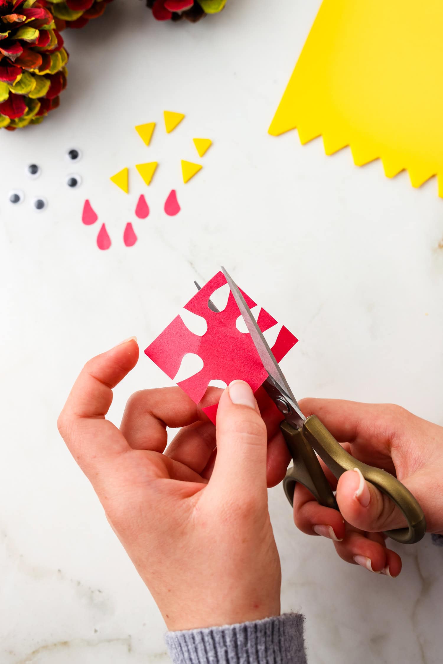 Picture of gobbler being cut out of red construction paper.
