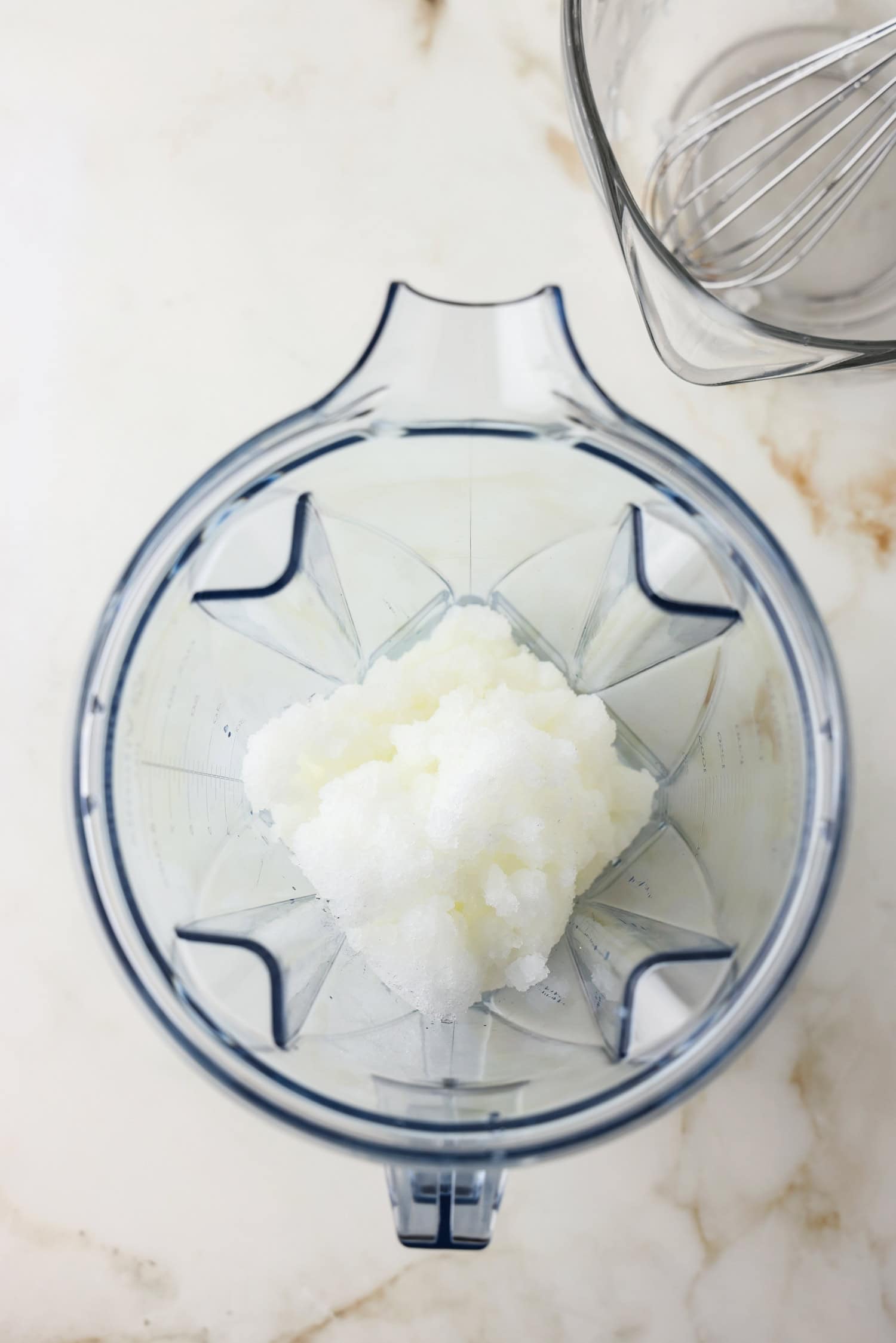 Overhead picture of snow ice cream in a blender.
