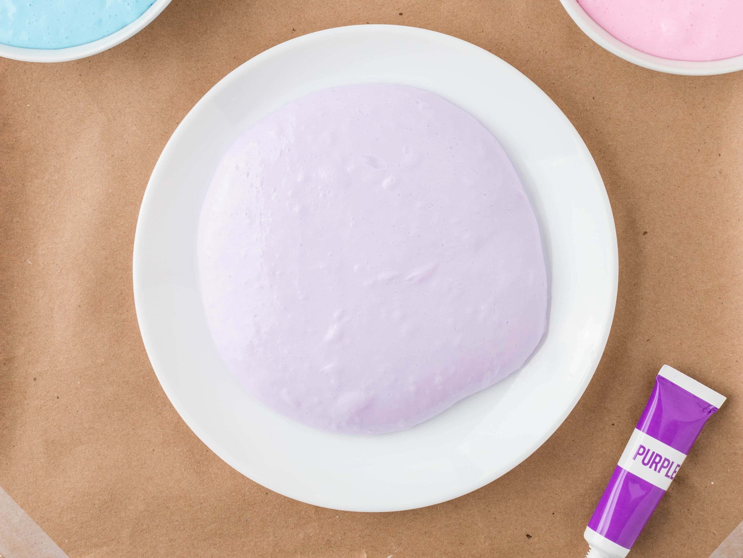 Split Fluffy Slime into sections and add food coloring