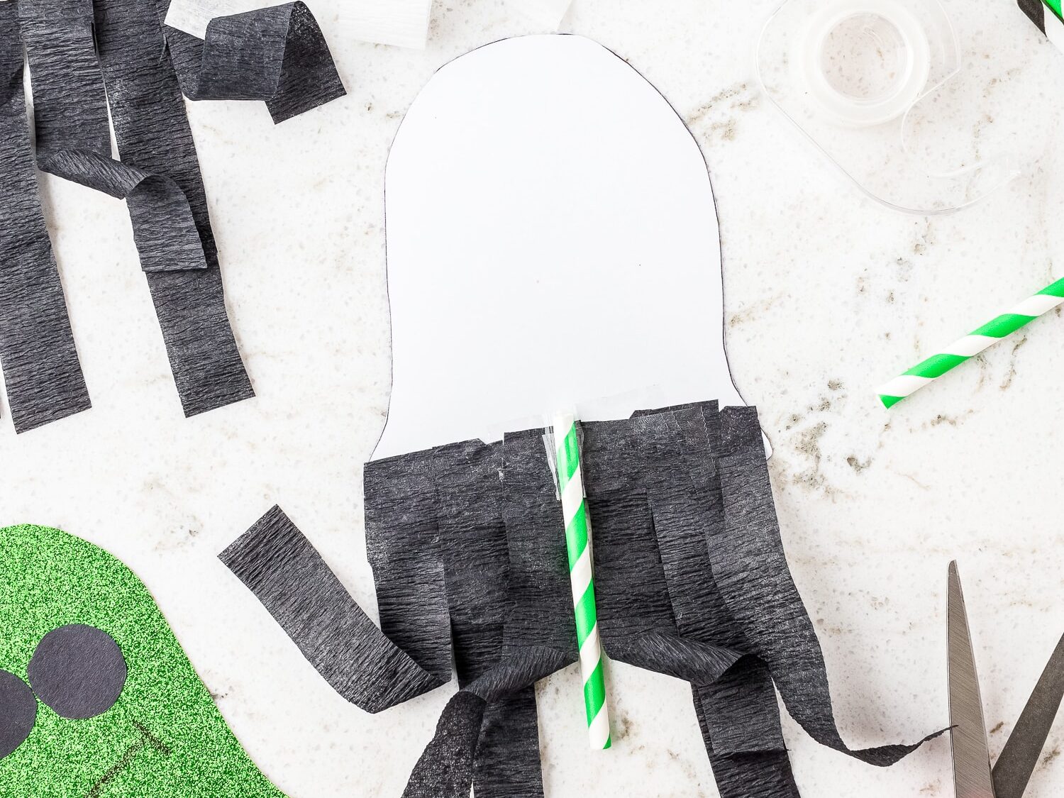 White ghost with black streamers