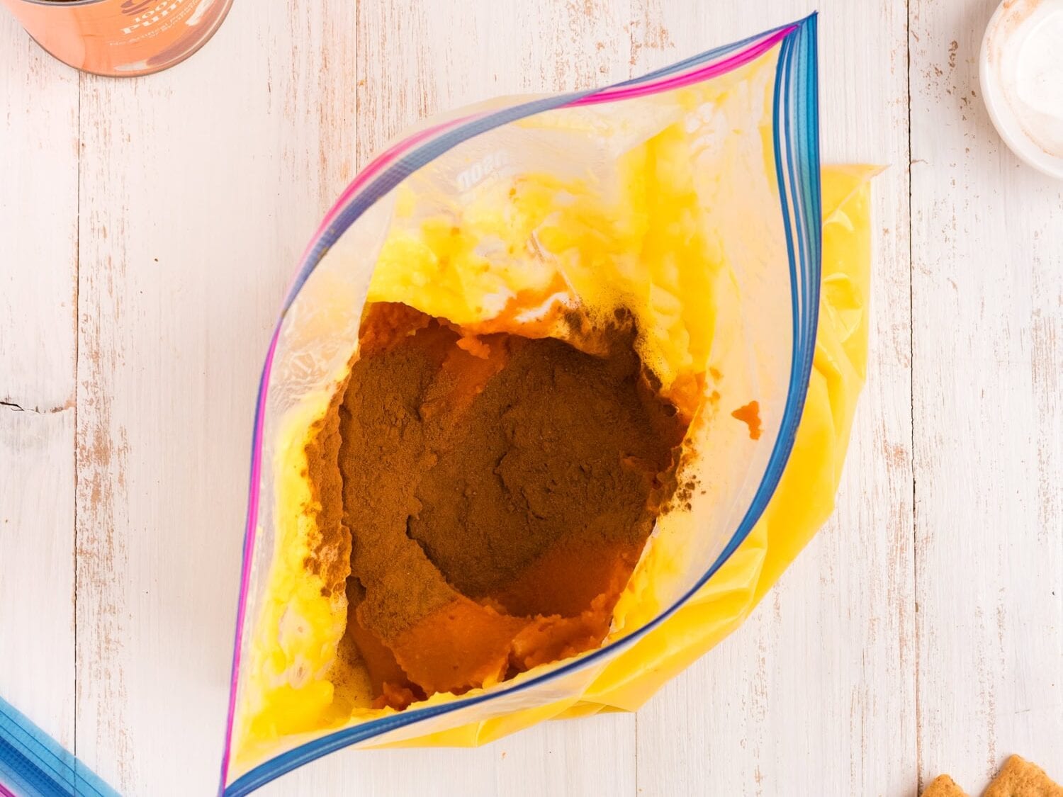 The gallon zip lock opened to add the spices for the Pumpkin Pie in a Bag recipe